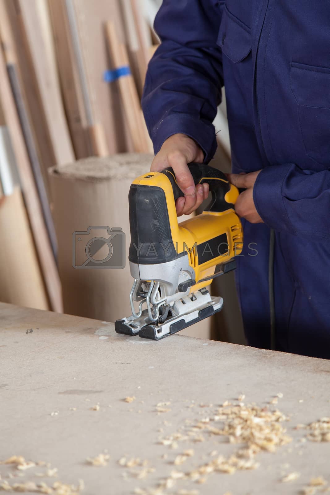 Royalty free image of Man with a electric saw by ifilms