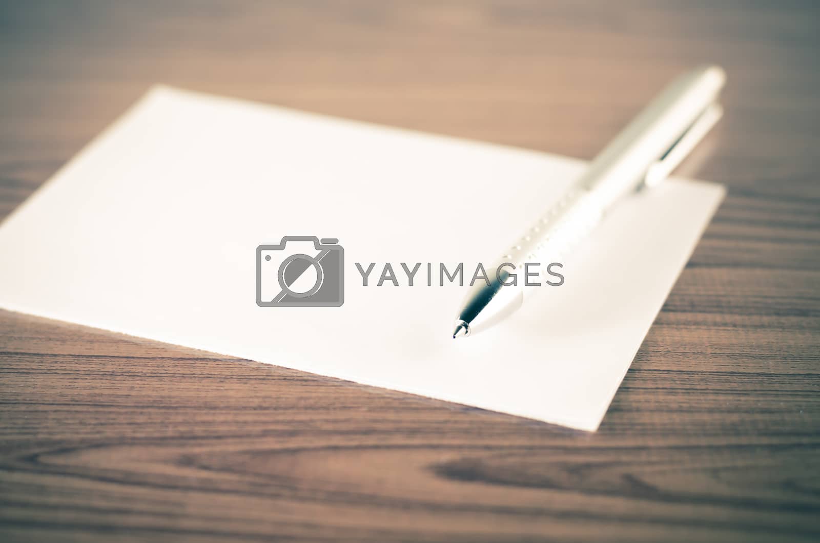 Royalty free image of pen with white paper by ammza12