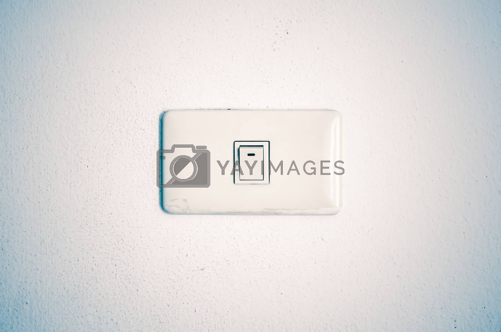 Royalty free image of white switch on wall by ammza12