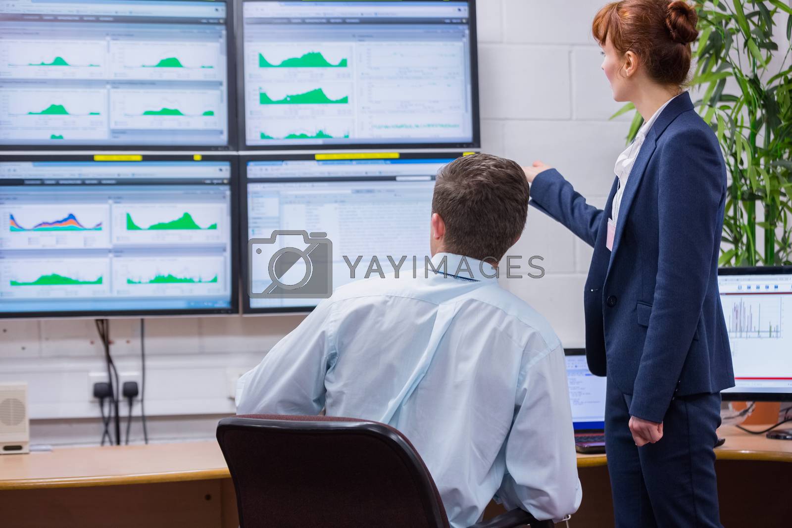 Royalty free image of Focused colleagues analyzing result on their computer by Wavebreakmedia