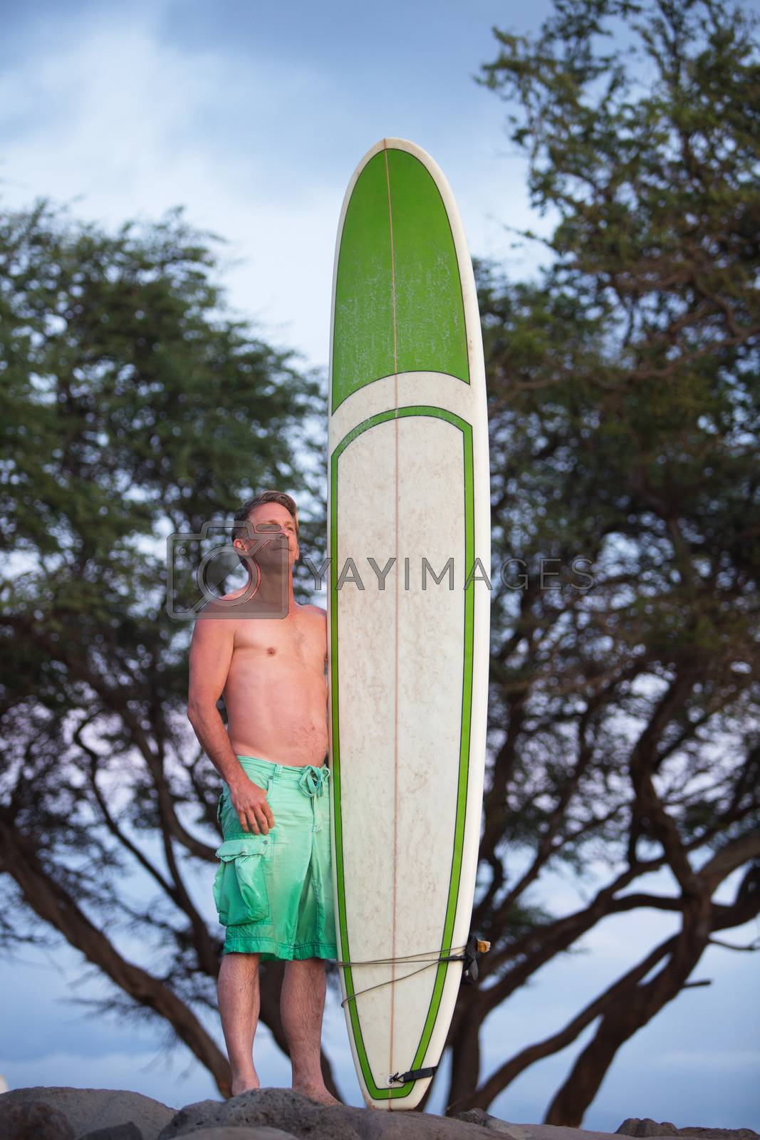 Royalty free image of Proud Surfer with Blank Surfboard by Creatista