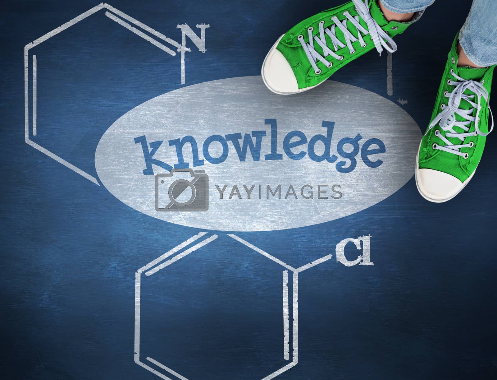 Royalty free image of Knowledge against blue chalkboard by Wavebreakmedia