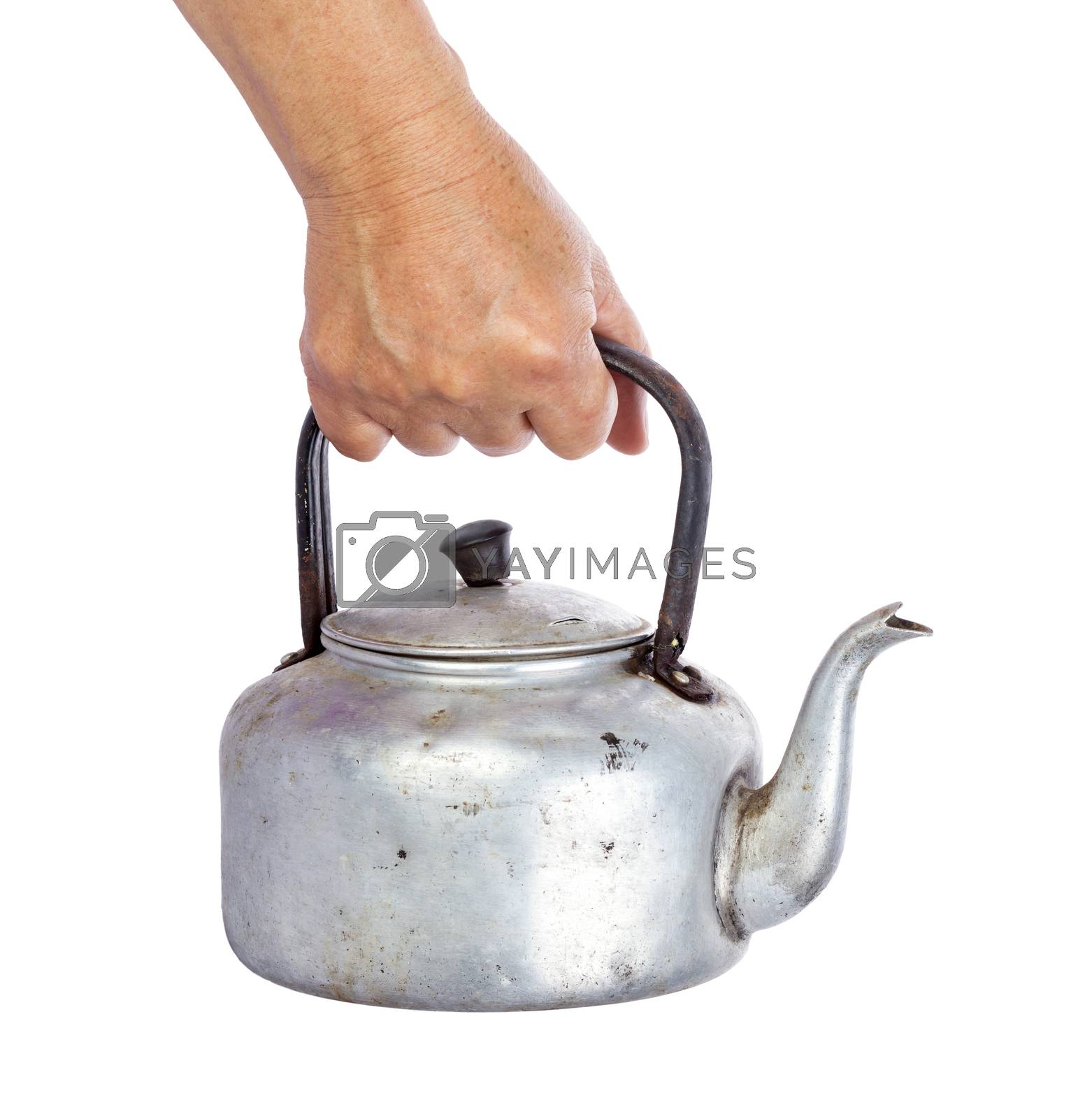 Royalty free image of old dirty classic aluminum kettle holding in hand isolated on wh by supersaiyan