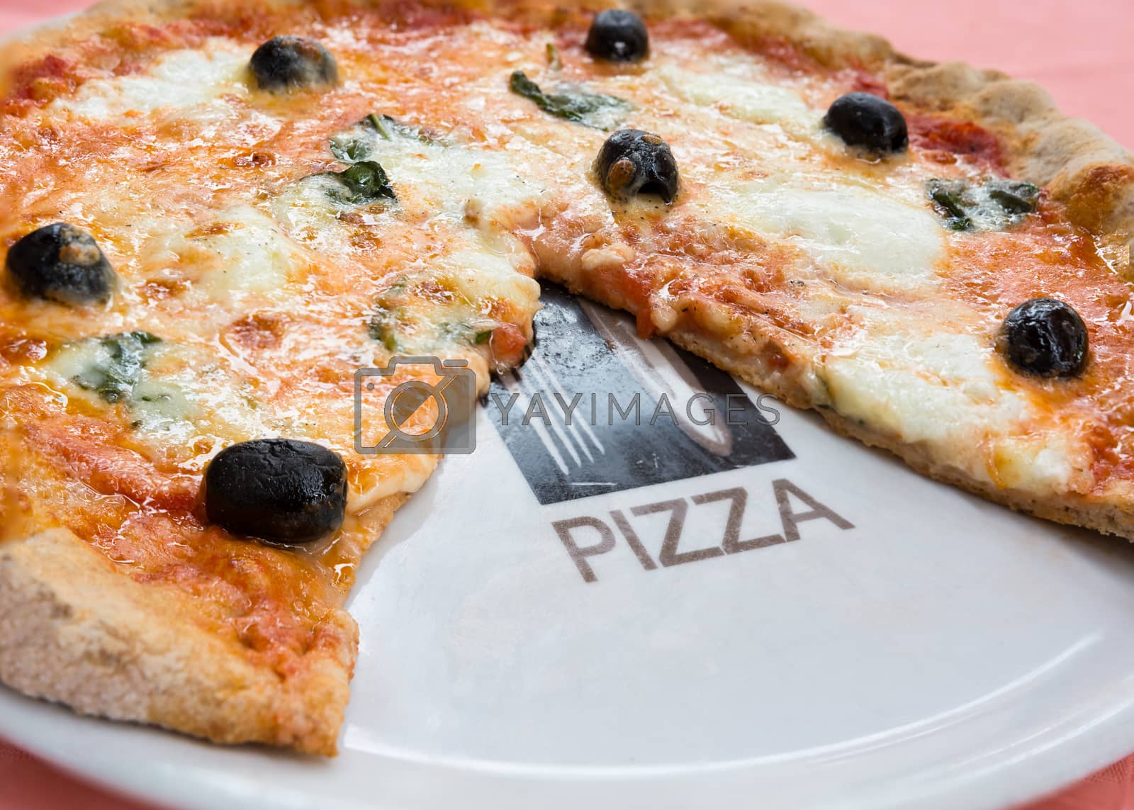 Royalty free image of wheat pizza with olives and basil by Robertobinetti70