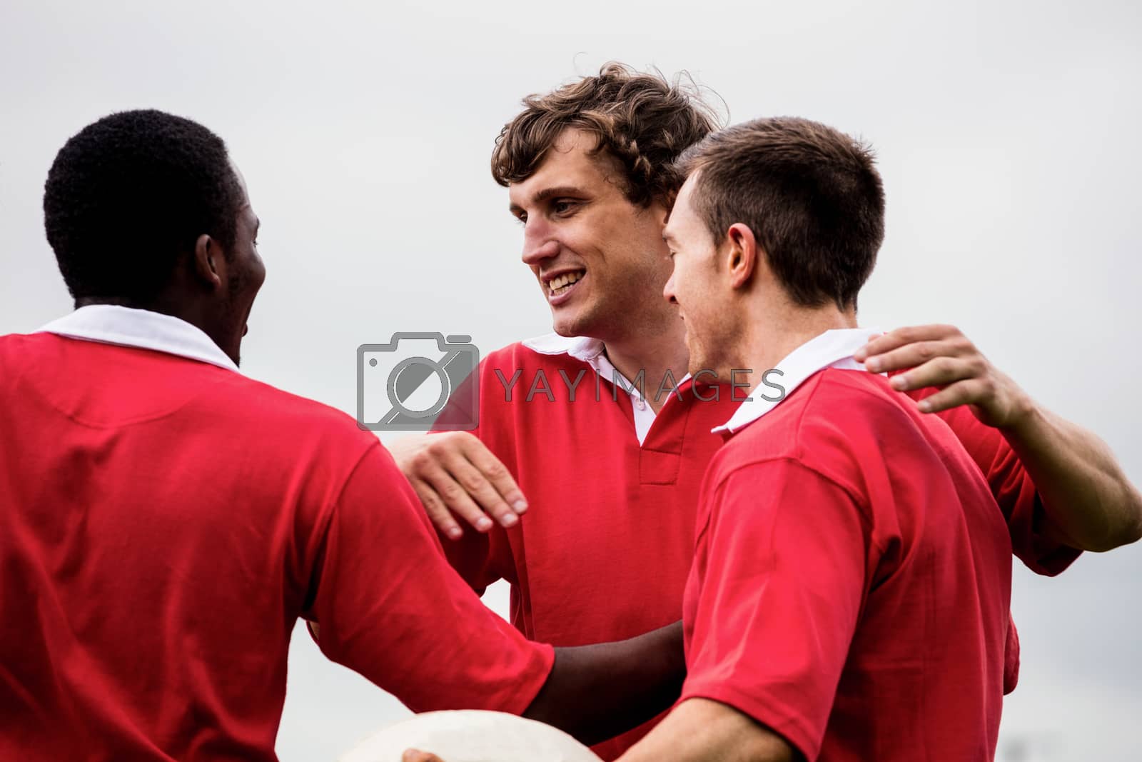 Royalty free image of Rugby players celebrating a win by Wavebreakmedia