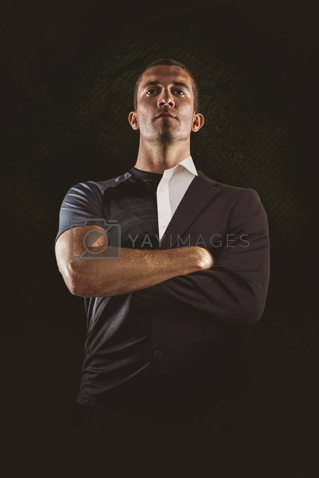 Royalty free image of Composite image of confident rugby player with arms crossed by Wavebreakmedia