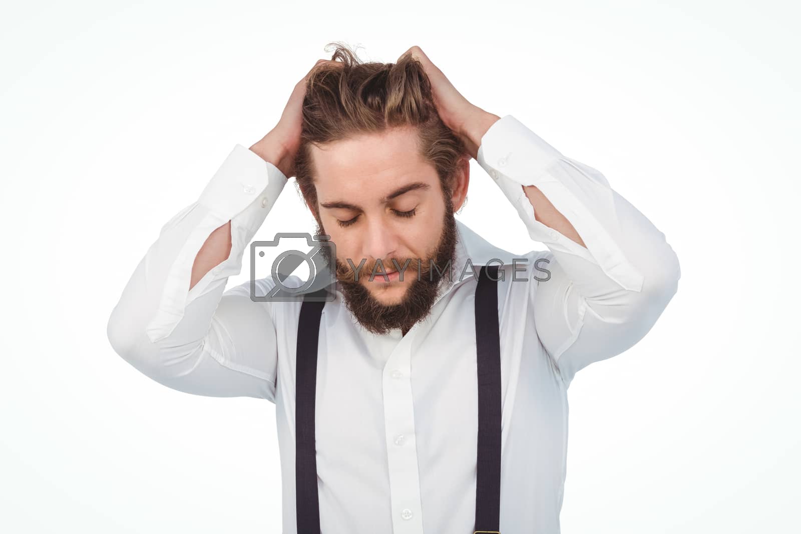 Royalty free image of Frustrated hipster with head in hands by Wavebreakmedia