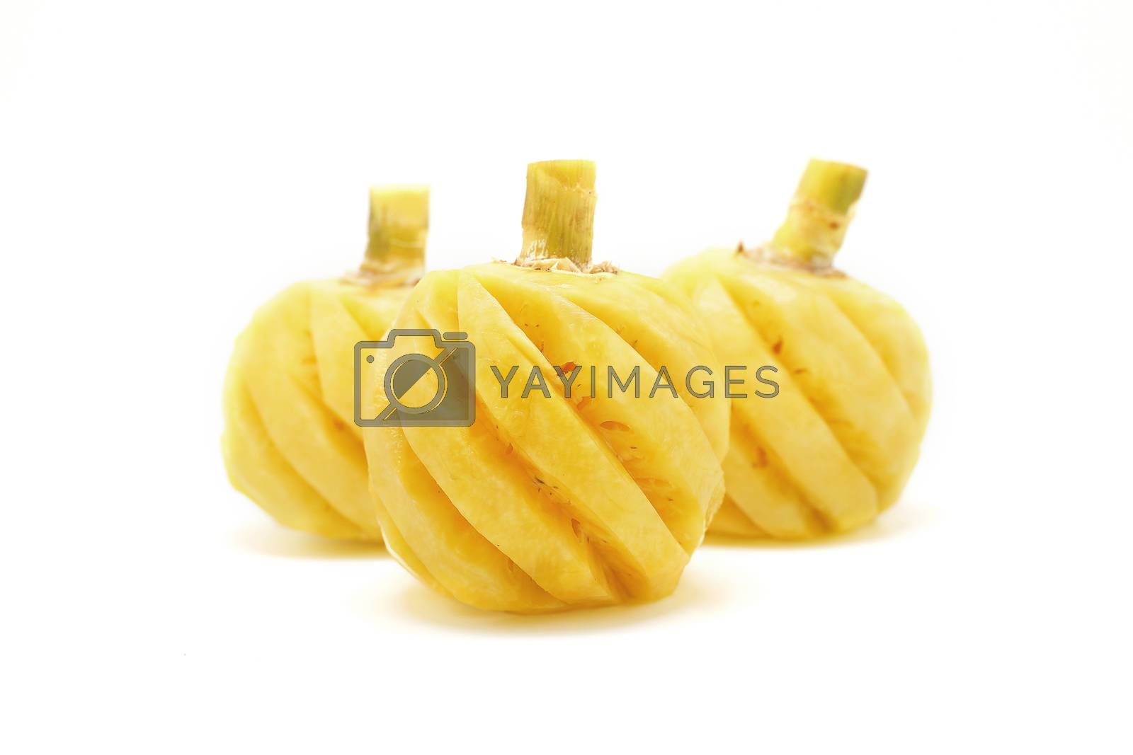 Royalty free image of peeled pineapple on white background by leisuretime70