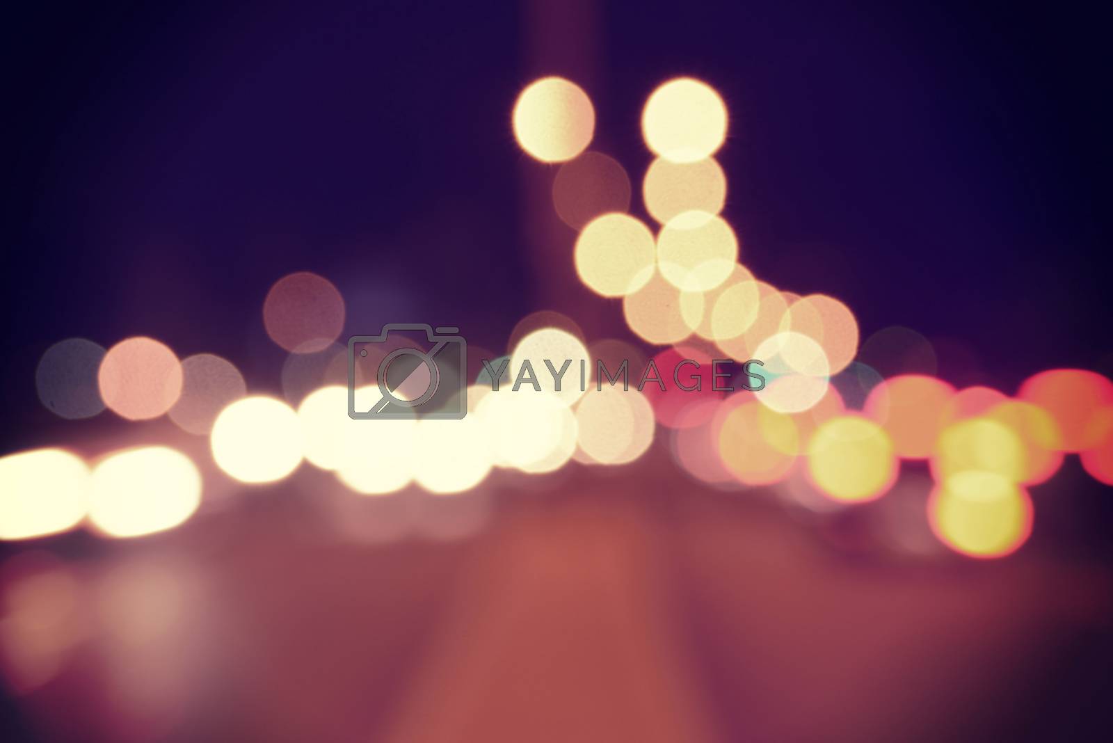 Royalty free image of Bokeh urban blur lights vintage hipster background by cienpies