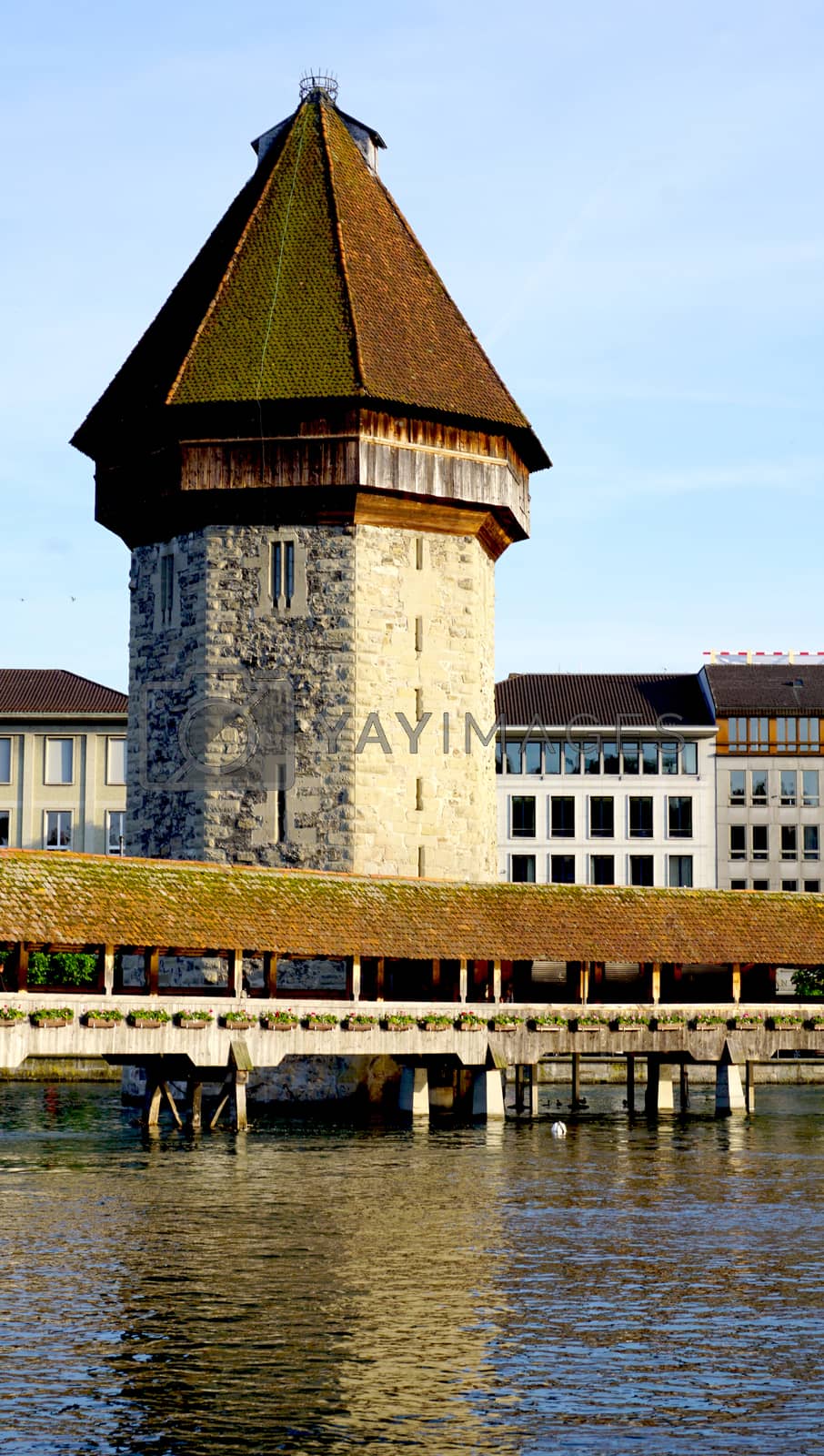 Royalty free image of close up tower and wooden Chapel Bridge in Lucerne by polarbearstudio