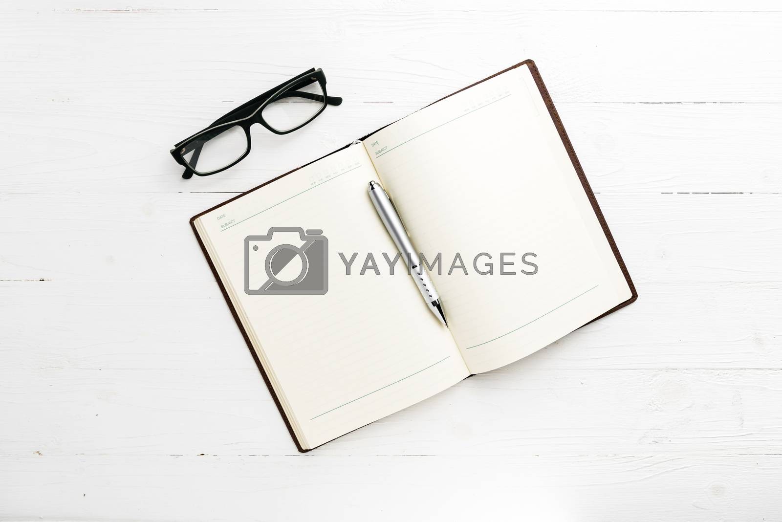 Royalty free image of open notebook with pen by ammza12