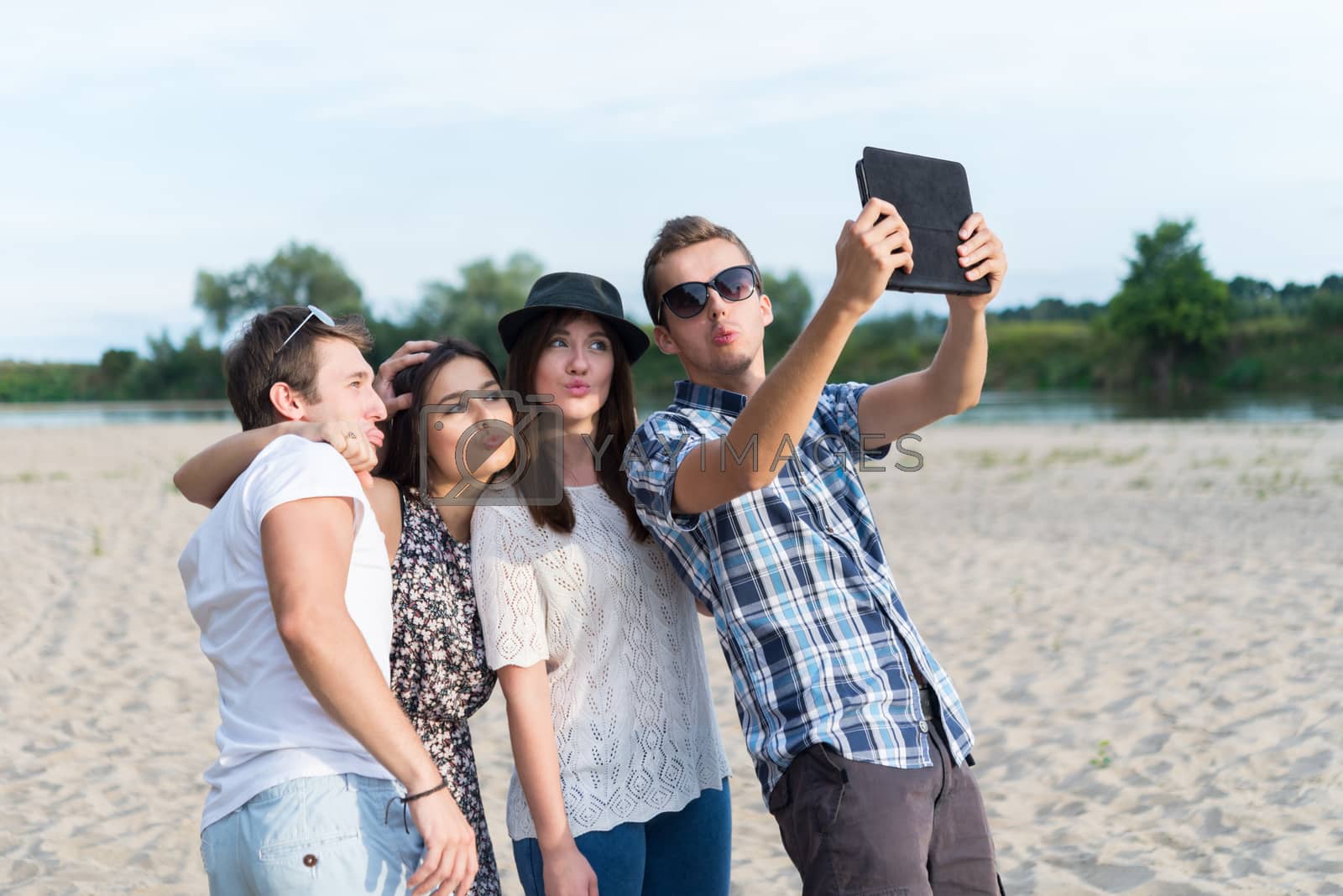 Royalty free image of Group Of Young Adult Friends Taking Selfie by rafalstachura