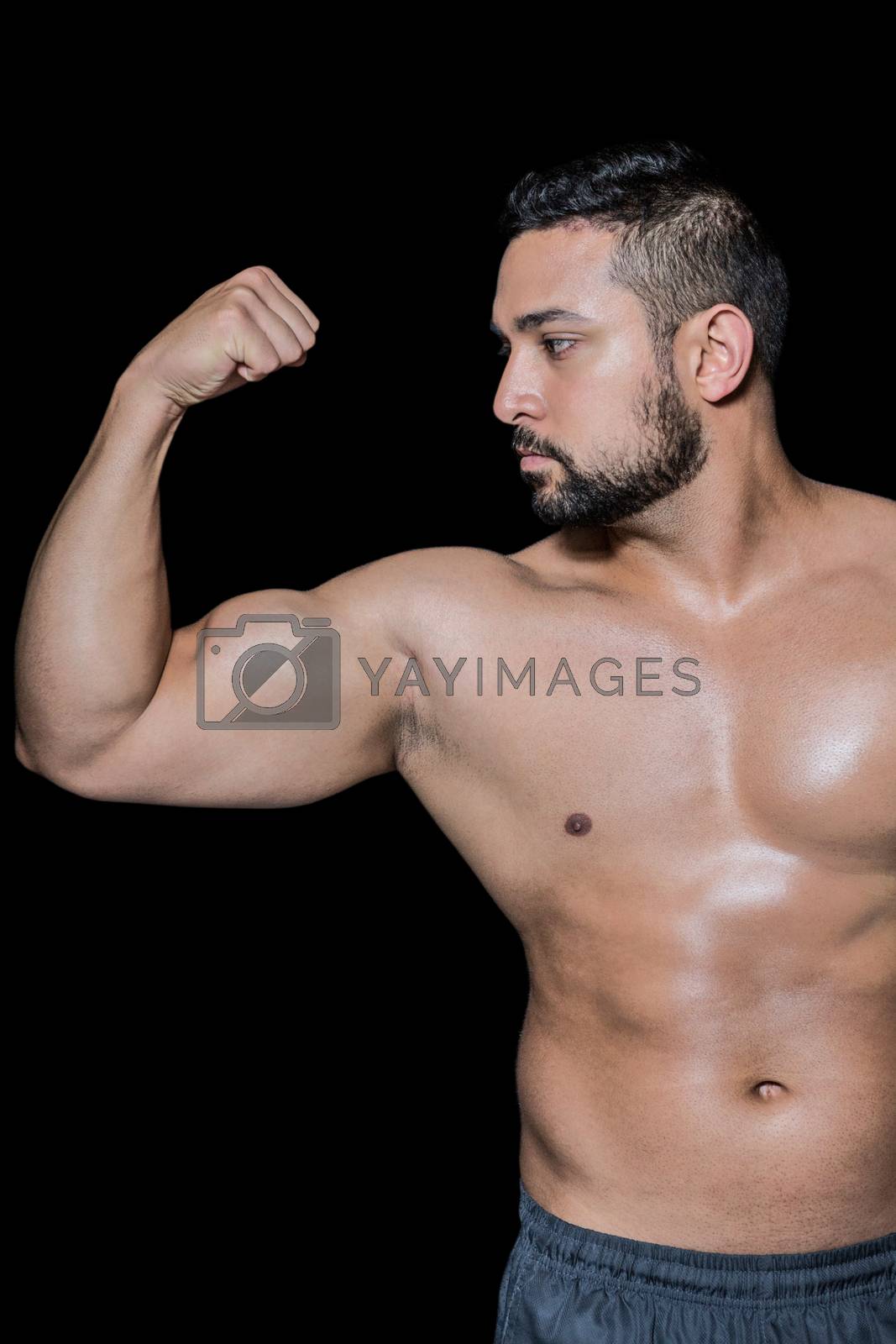 Royalty free image of Bodybuilder man flexing his muscles by Wavebreakmedia