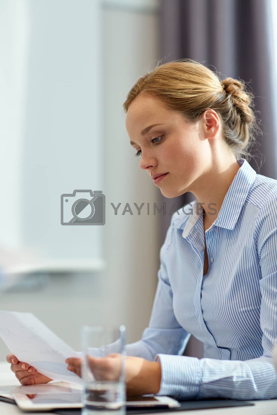 Royalty free image of businesswoman having problem in office by dolgachov