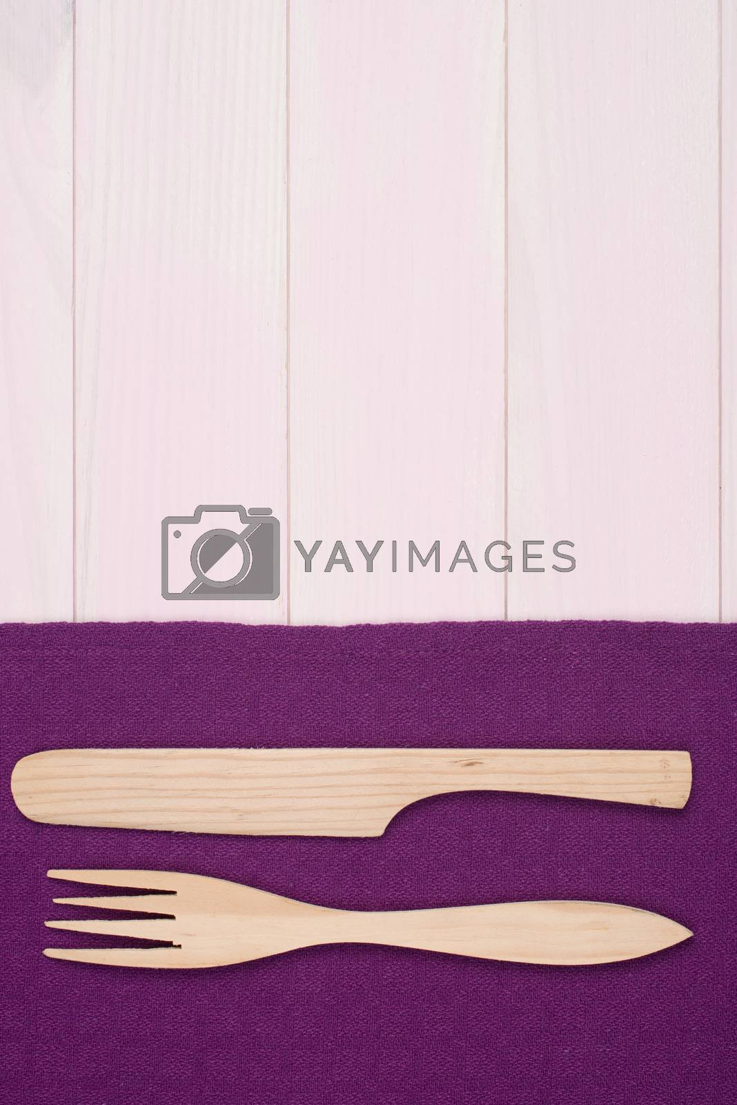 Royalty free image of Kitchenware on purple towel by homydesign