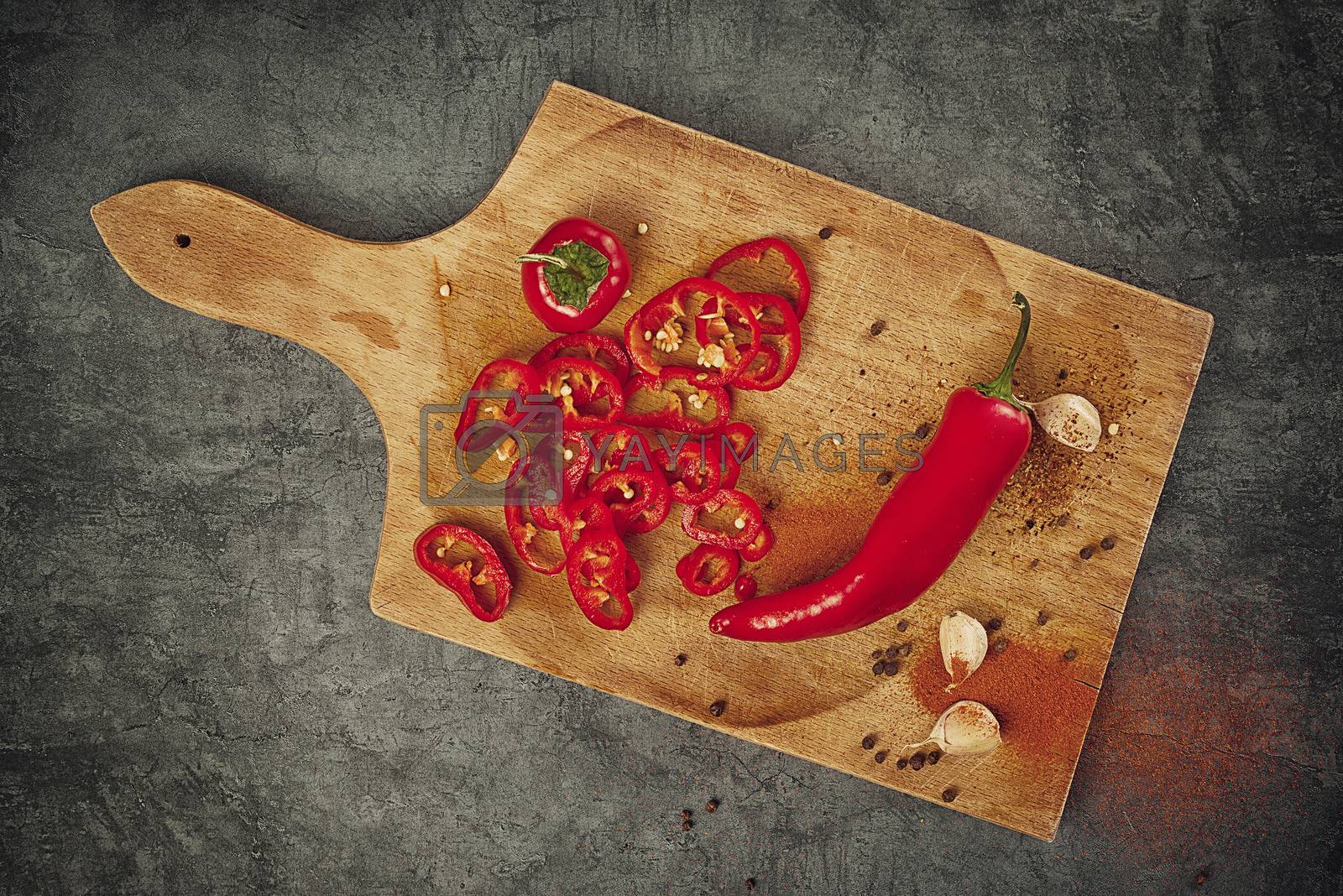 Red Hot Chili Pepper, Spice and Organic Garlic on Wooden Kitchen Plate as Hot Food Ingredients for Spicy Piquant Cuisine, Top View
