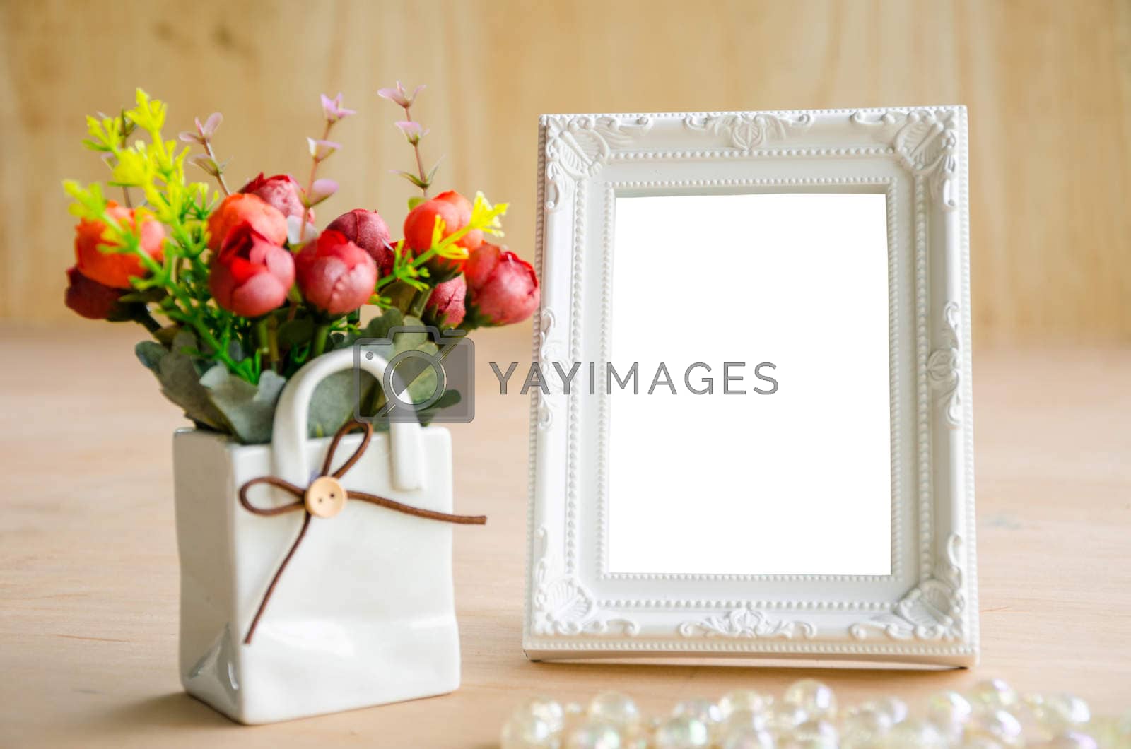Royalty free image of Blank vintage photo fame and flower. by Gamjai