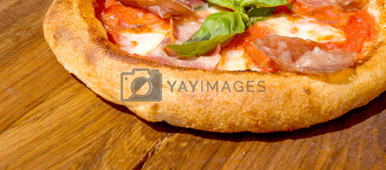 Royalty free image of Fresh pizza on a thick dough by vlaru