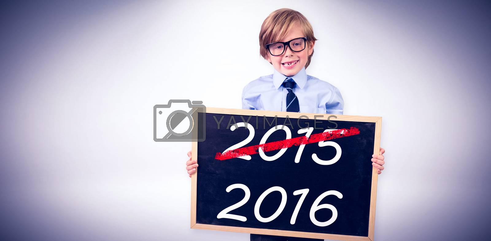 Royalty free image of Composite image of cute pupil holding chalkboard by Wavebreakmedia
