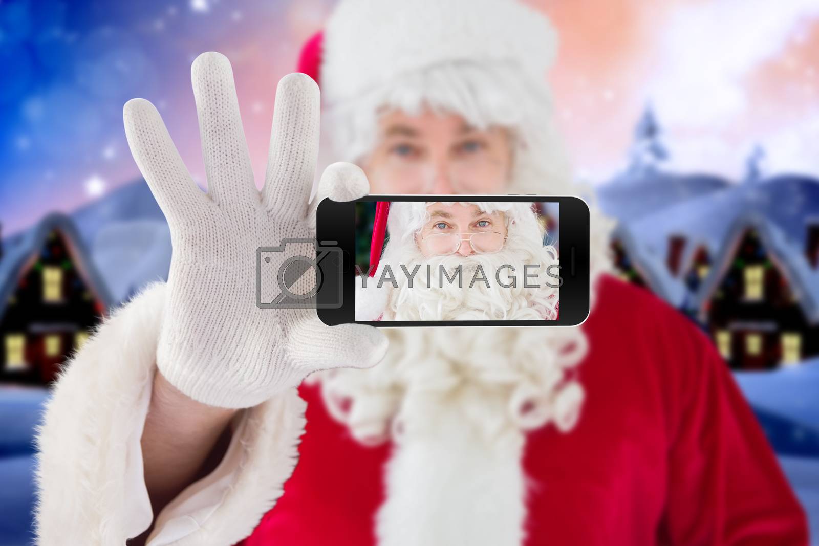 Royalty free image of Composite image of hand holding mobile phone by Wavebreakmedia