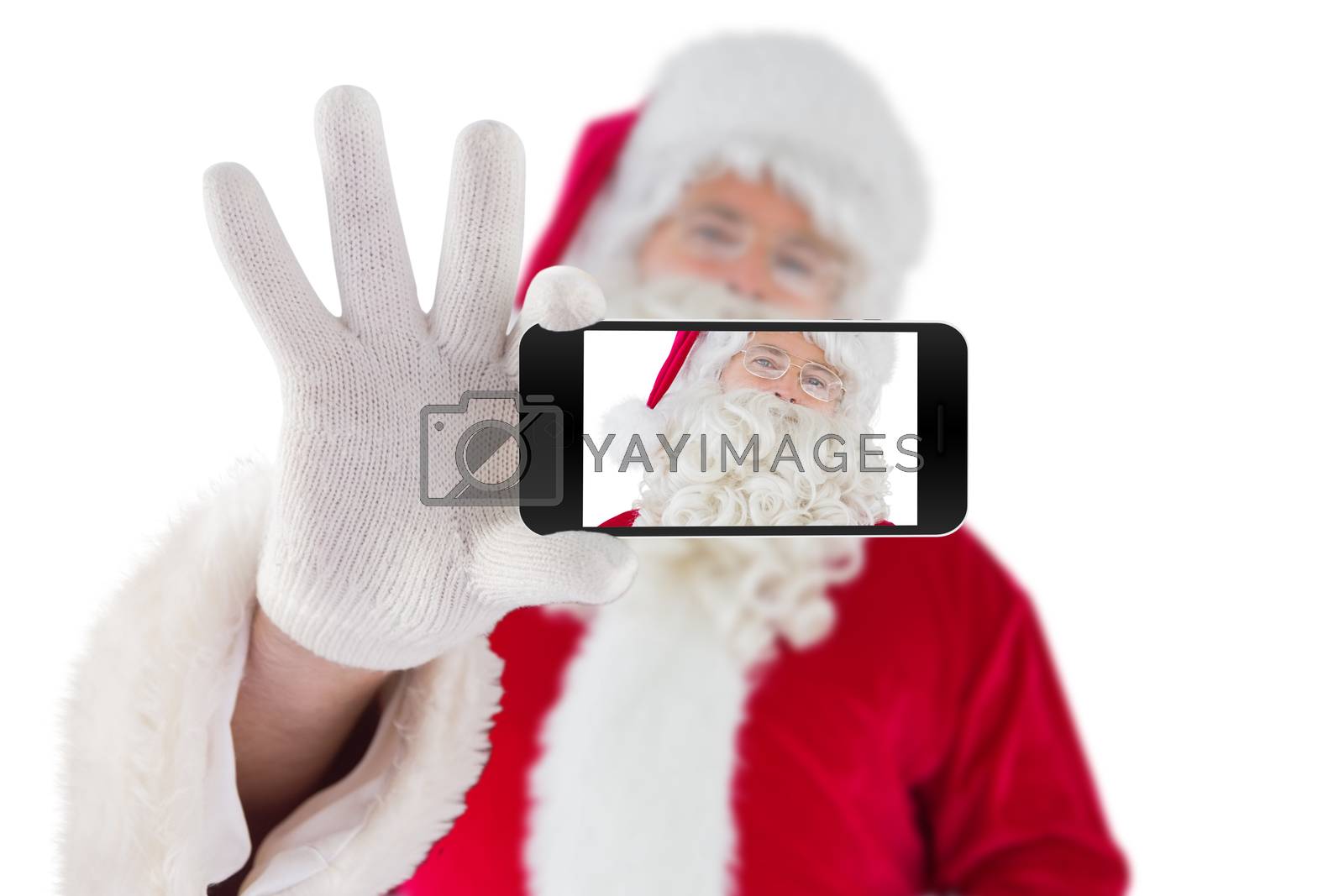 Royalty free image of Composite image of hand holding mobile phone by Wavebreakmedia