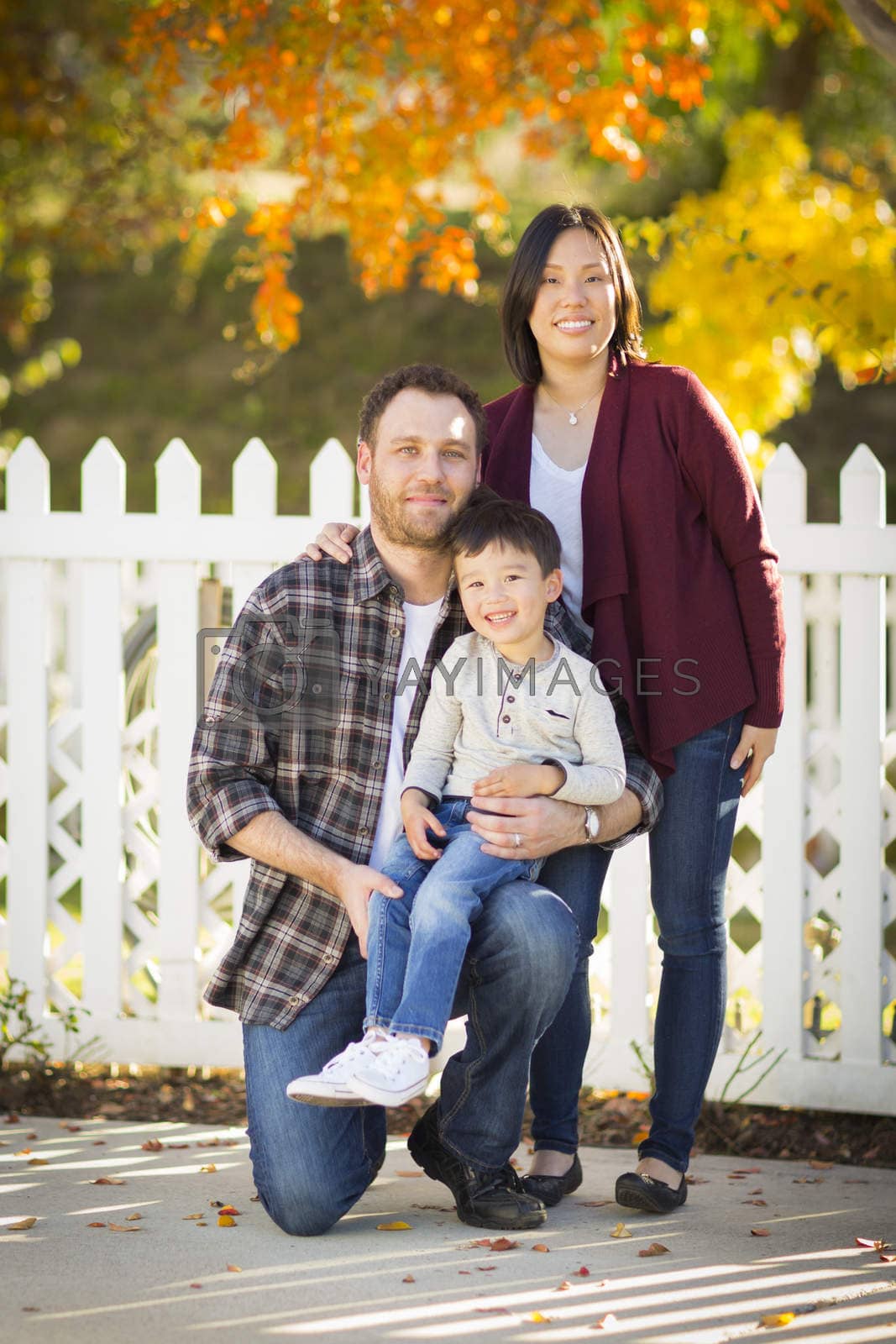 Royalty free image of Mixed Race Young Family Portrait Outdoors by Feverpitched