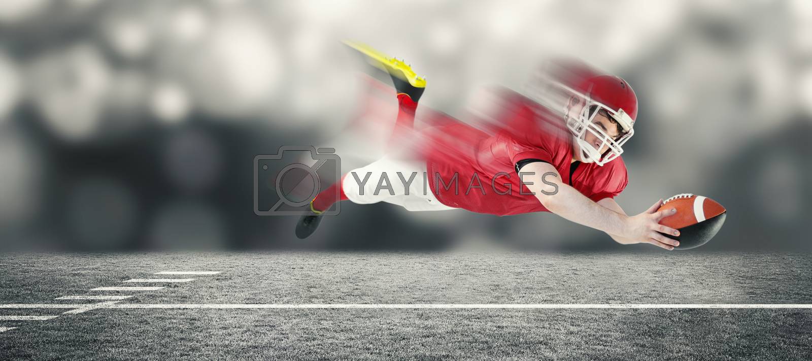Royalty free image of Composite image of american football player scoring a touchdown by Wavebreakmedia