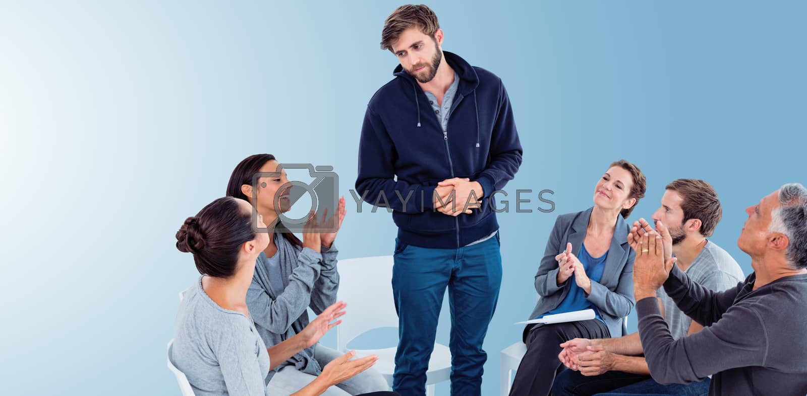Royalty free image of Composite image of rehab group applauding delighted man standing up by Wavebreakmedia