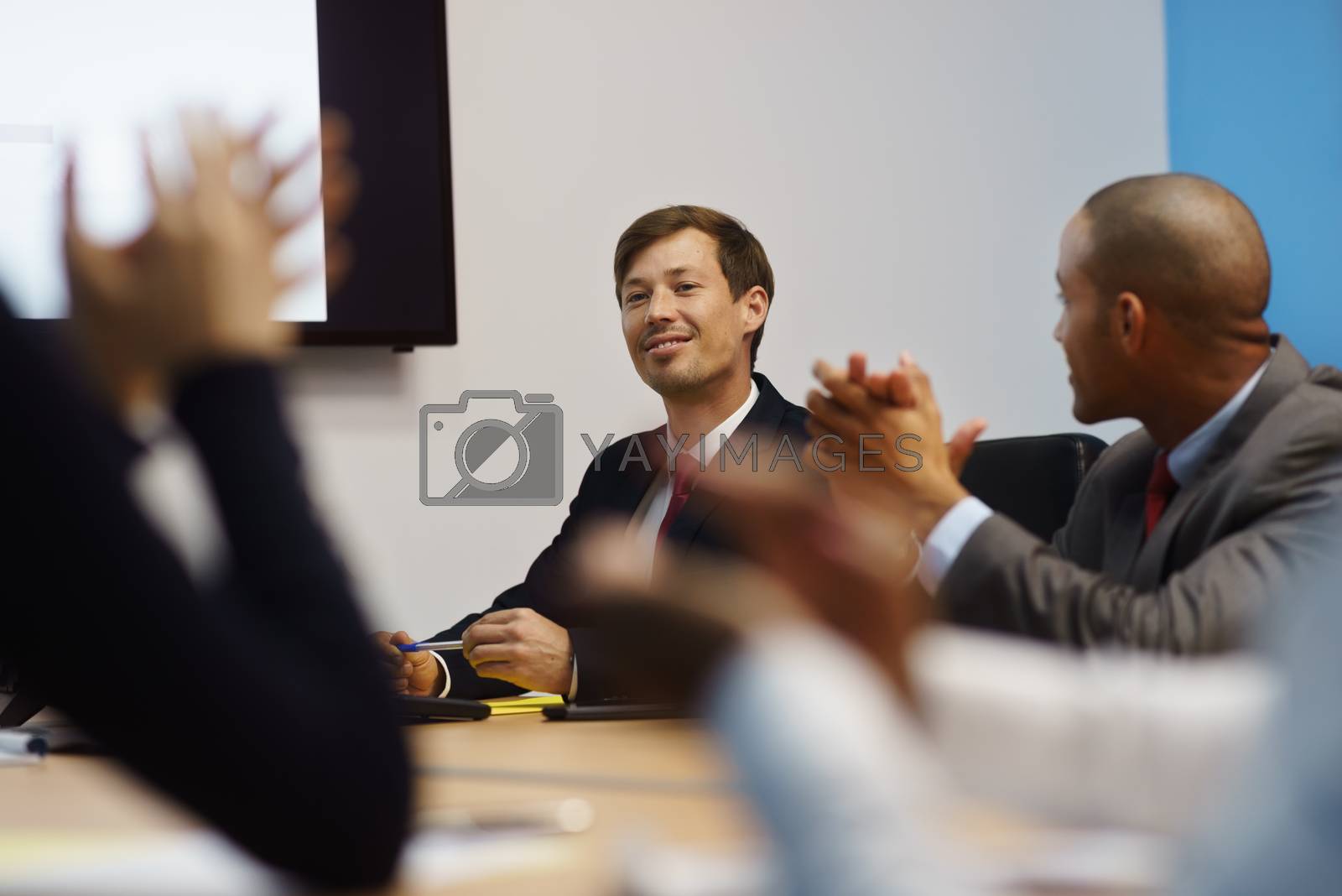 Royalty free image of Business Man Doing Presentation And People Applauding In Meeting by diego_cervo