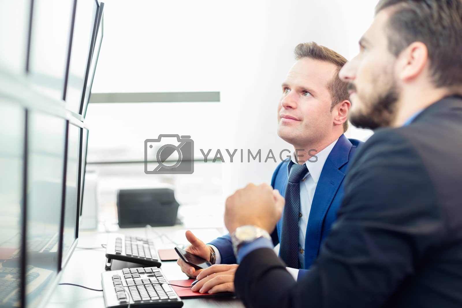 Royalty free image of Successful businessmen in office. Business success. by kasto