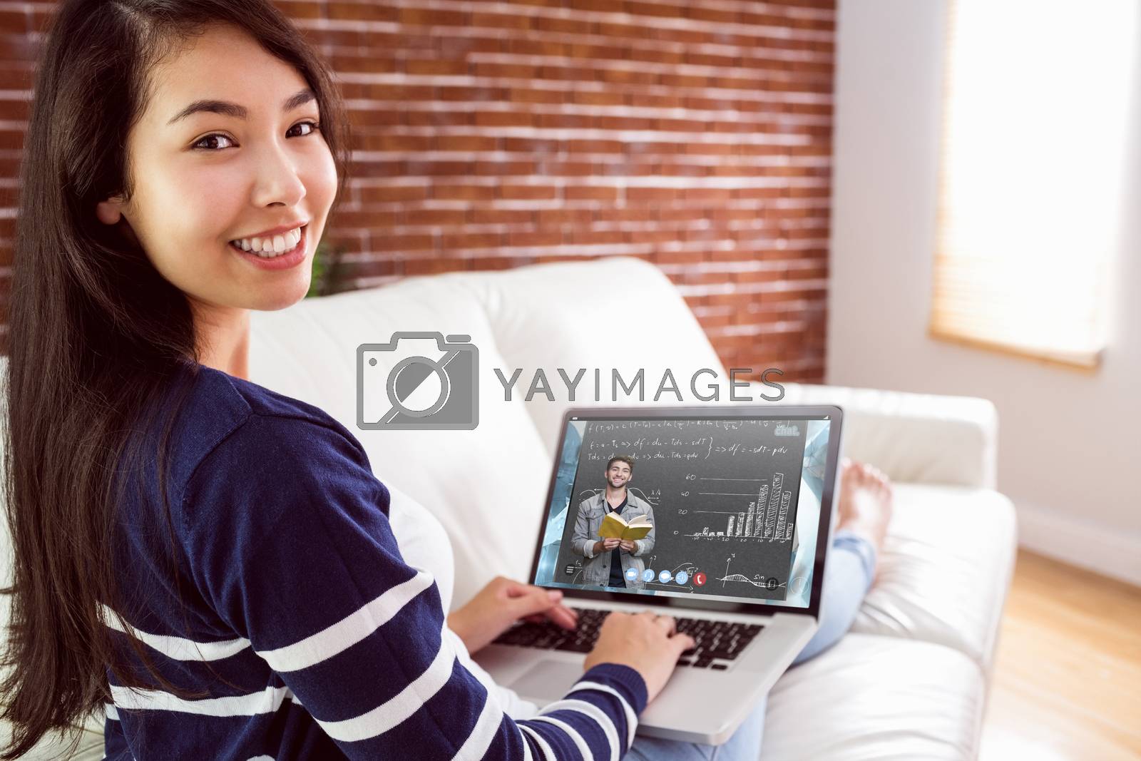 Royalty free image of Composite image of student smiling at camera in library by Wavebreakmedia