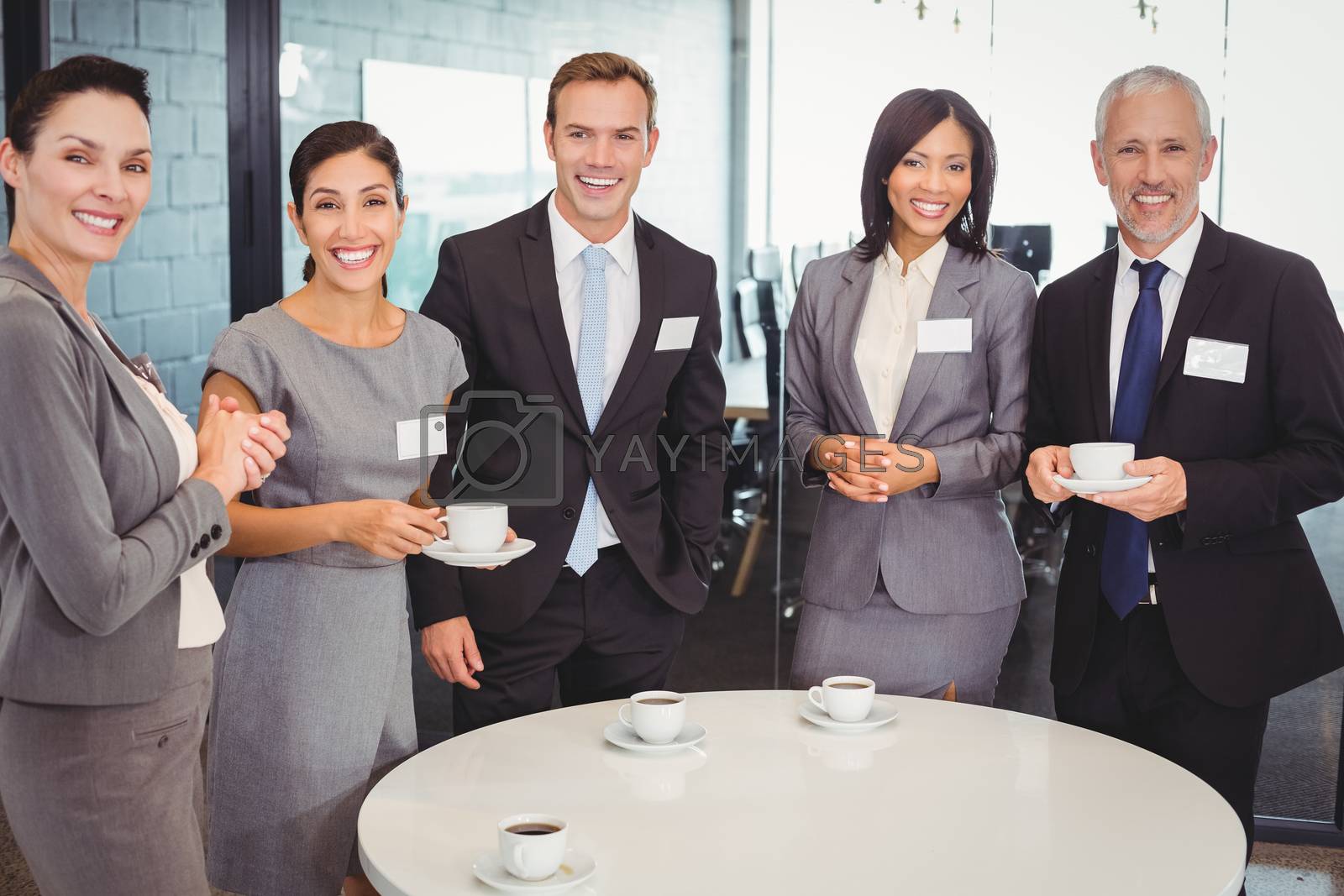 Royalty free image of Portrait of businesspeople having tea during breaktime by Wavebreakmedia