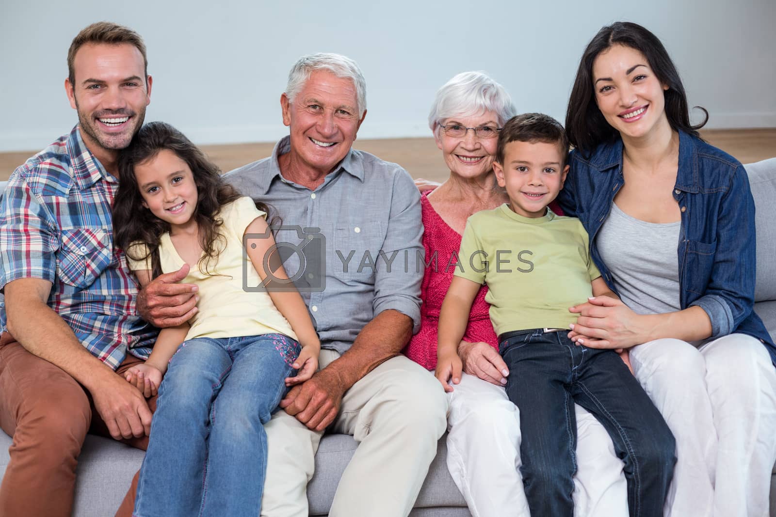 Royalty free image of Family sitting on sofa by Wavebreakmedia