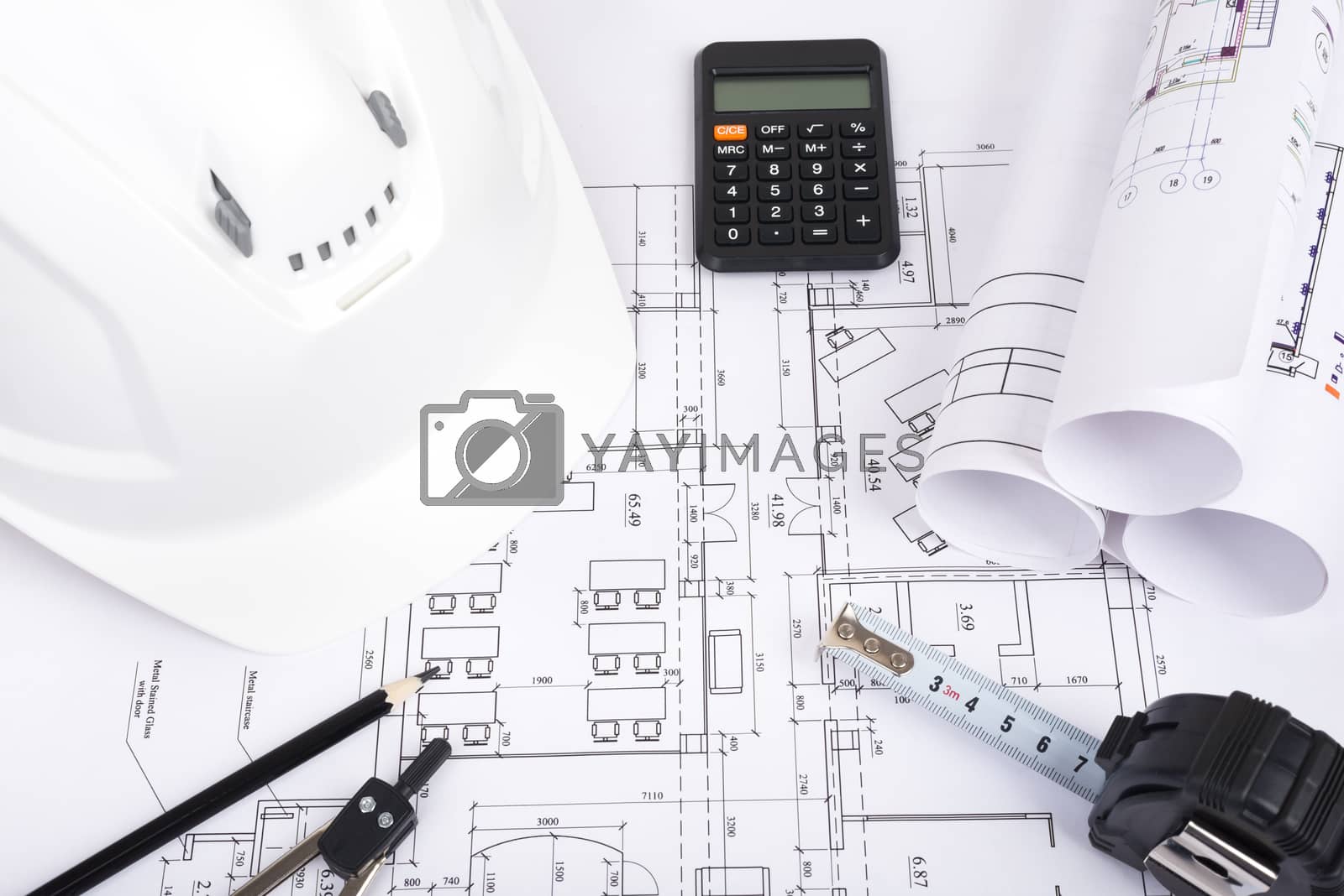 Royalty free image of Architecture plan and rolls of blueprints by cherezoff