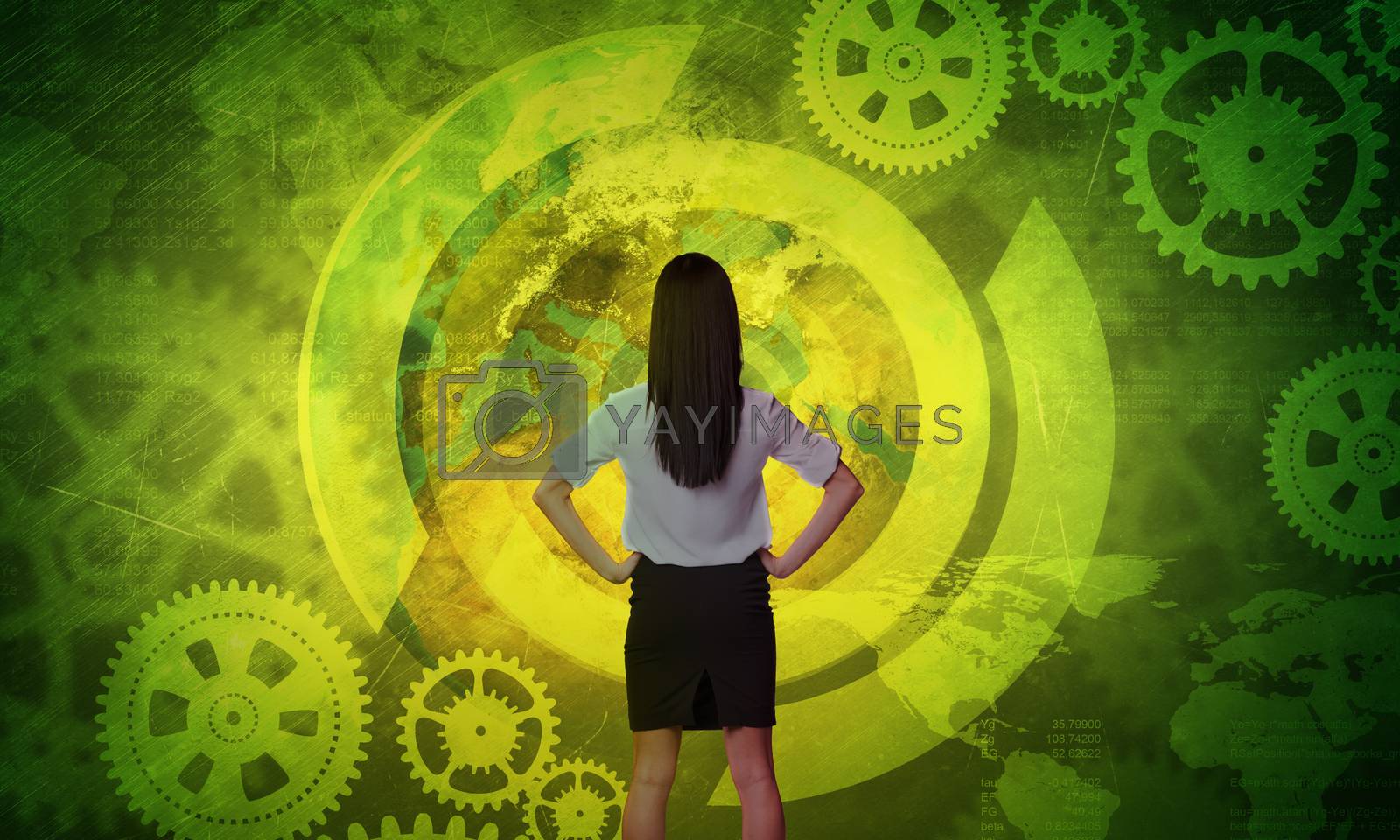 Royalty free image of Business woman in front of holographic screen by cherezoff