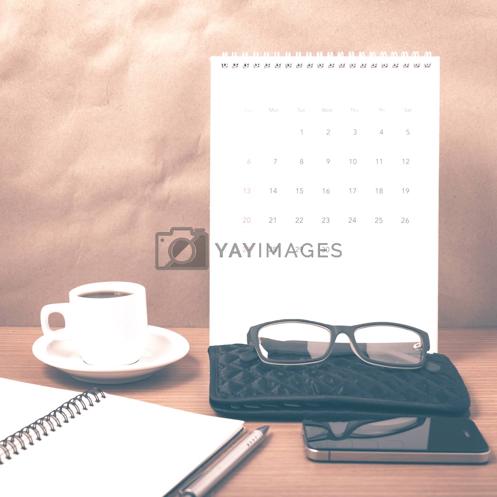 Royalty free image of office desk : coffee with phone,calendar,wallet,notepad vintage  by ammza12