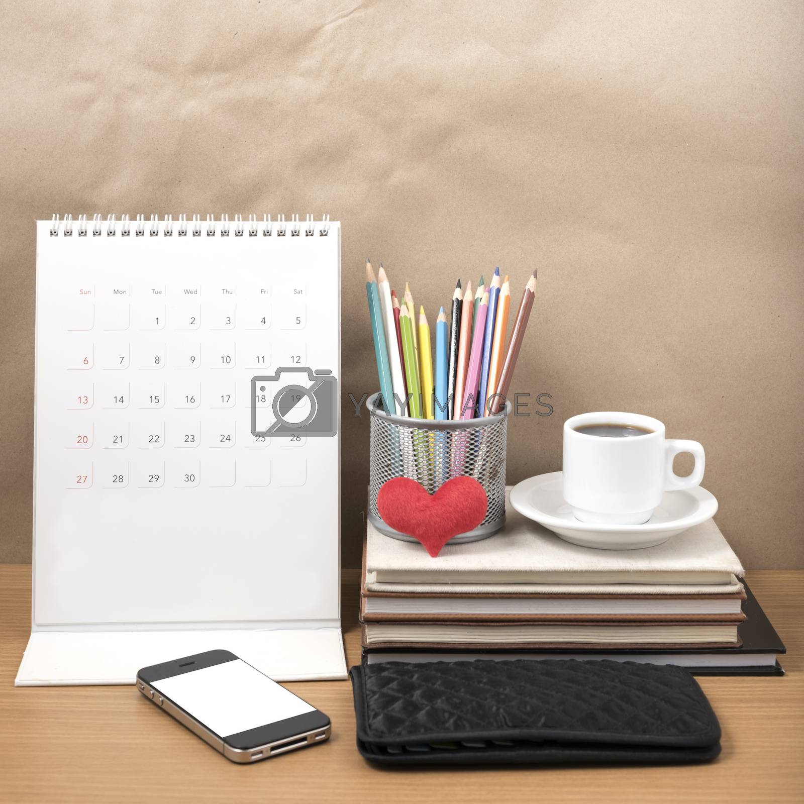 Royalty free image of office desk : coffee with phone,wallet,calendar,heart,color penc by ammza12