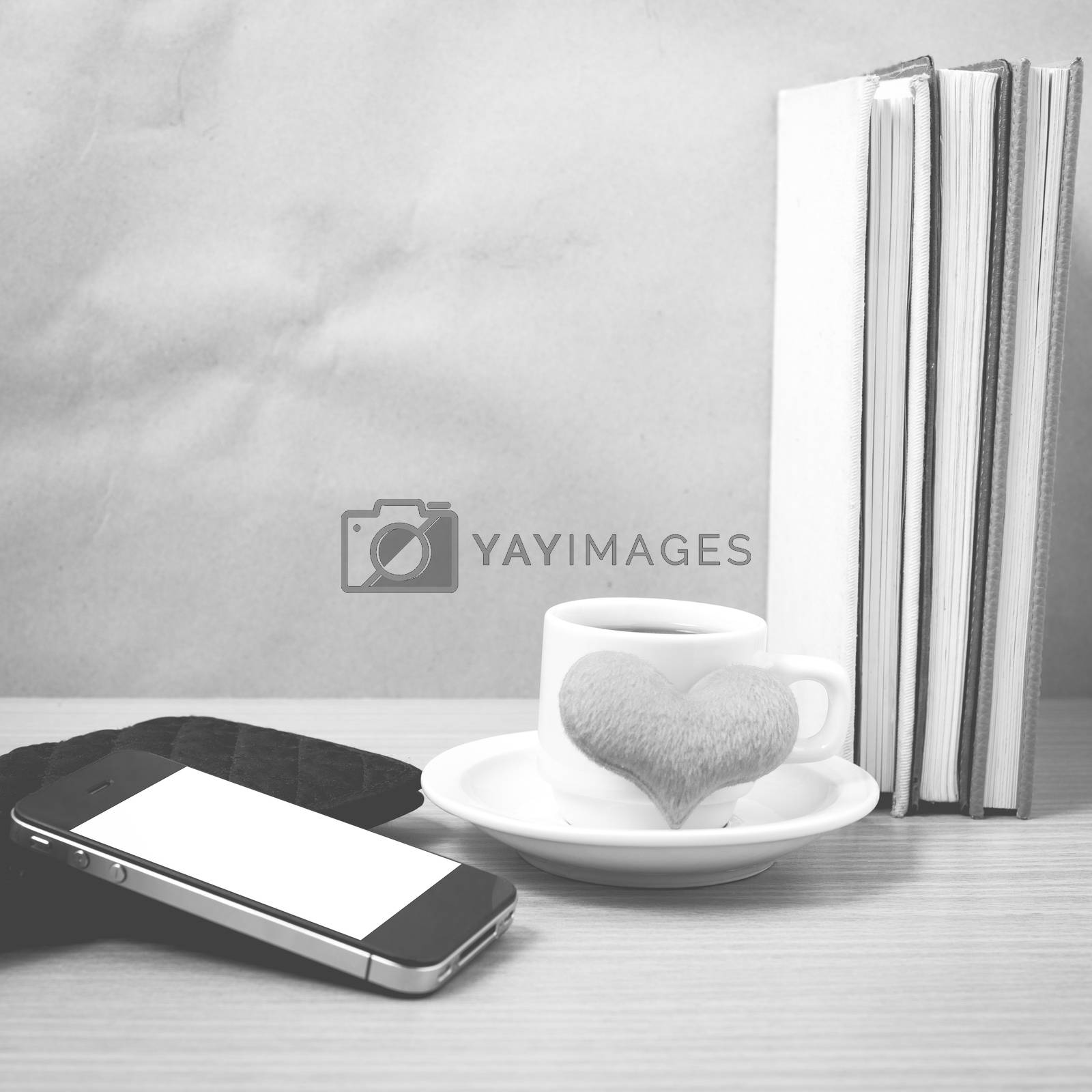 Royalty free image of working table : coffee with phone,stack of book,wallet and heart by ammza12