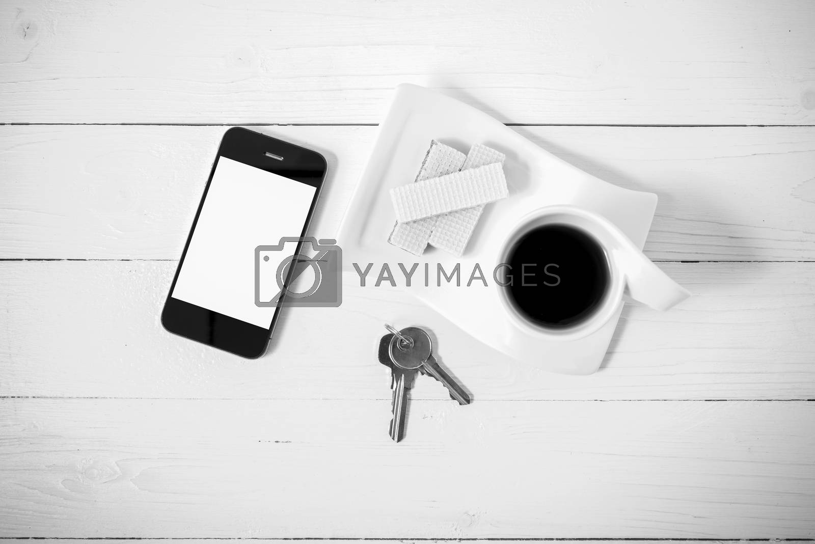 Royalty free image of coffee cup with wafer,phone,key black and white color by ammza12