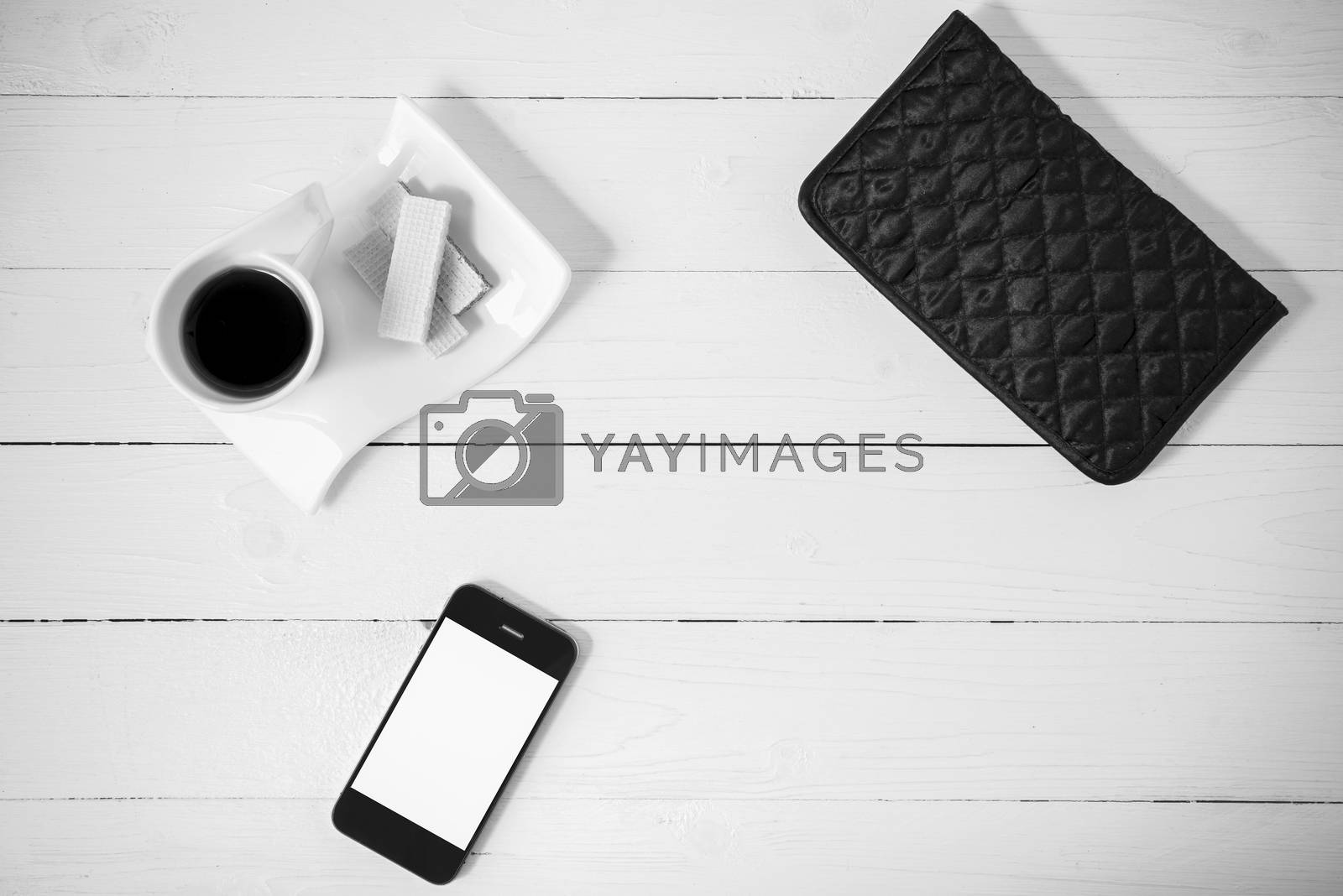 Royalty free image of coffee cup with wafer,phone,wallet black and white color by ammza12