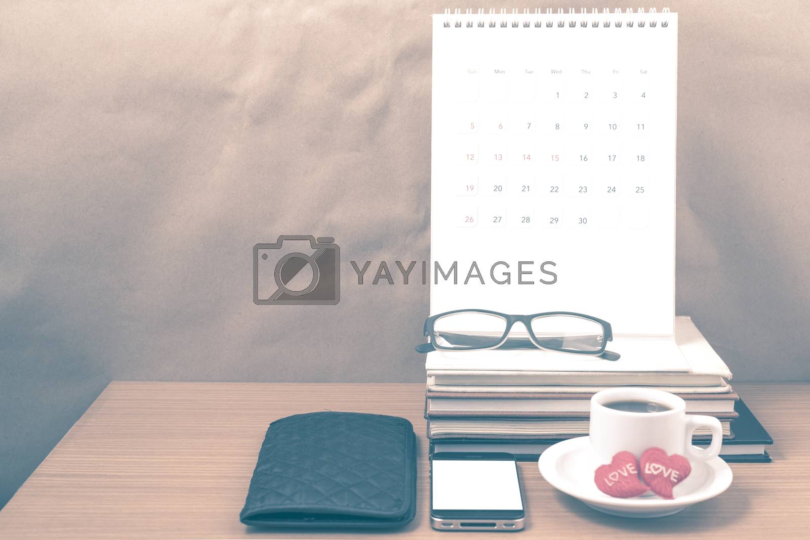 Royalty free image of office desk : coffee with phone,wallet,calendar,heart,stack of b by ammza12