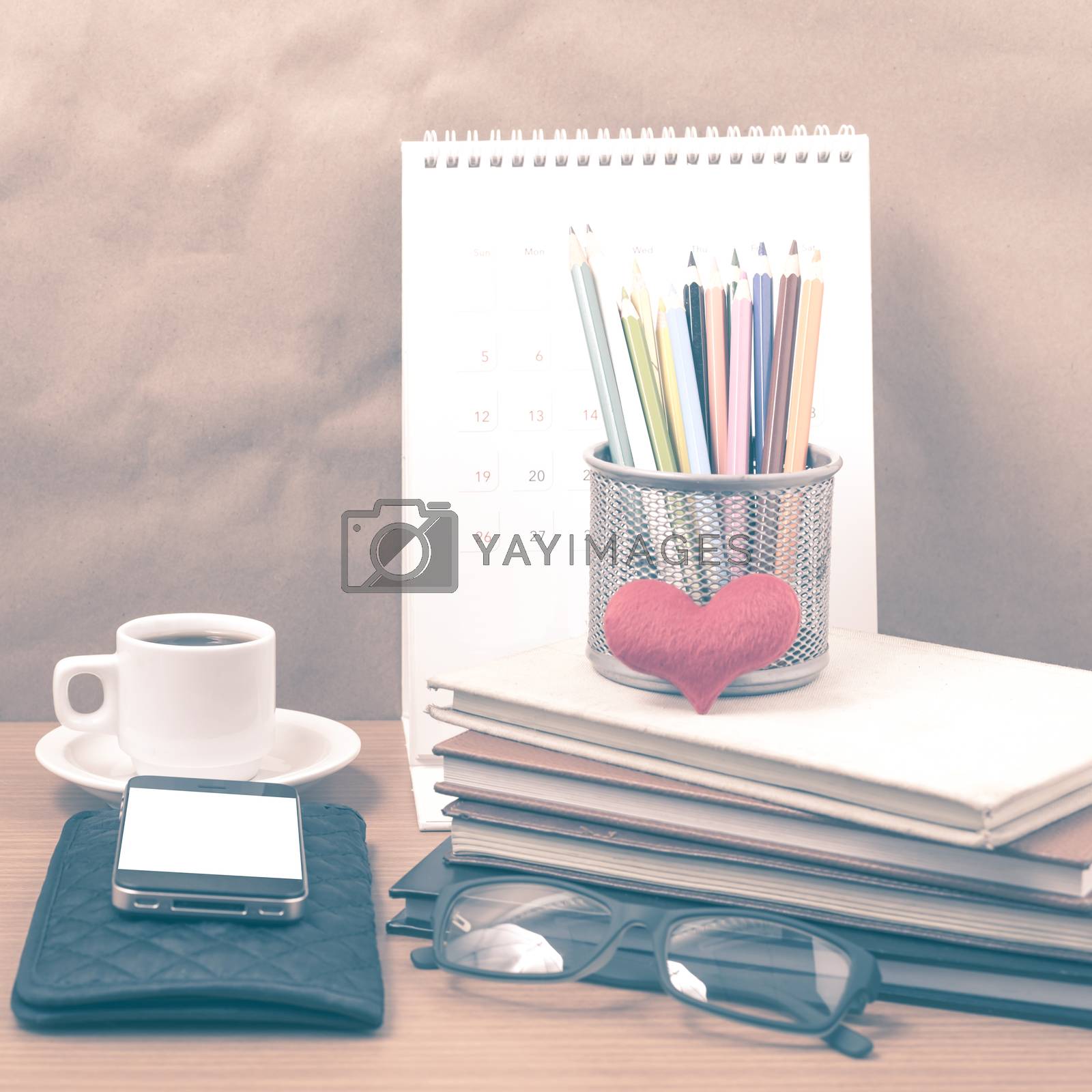 Royalty free image of office desk : coffee with phone,wallet,calendar,color pencil box by ammza12