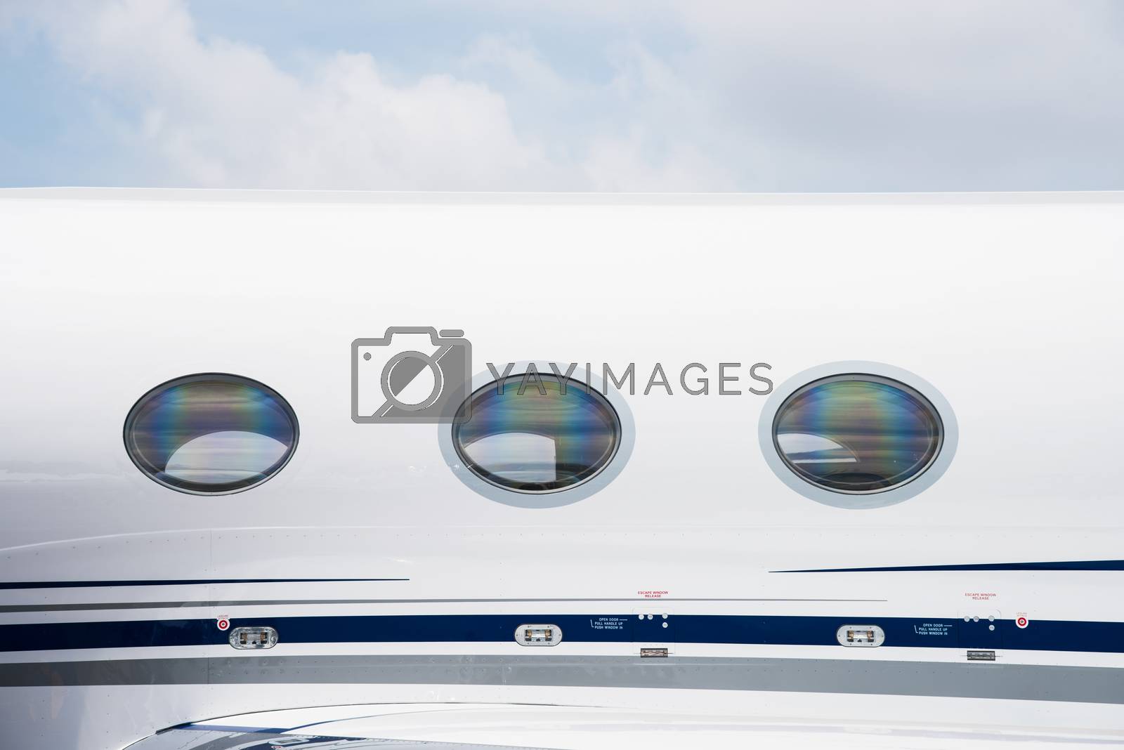 Royalty free image of Windows of business jet by epixx