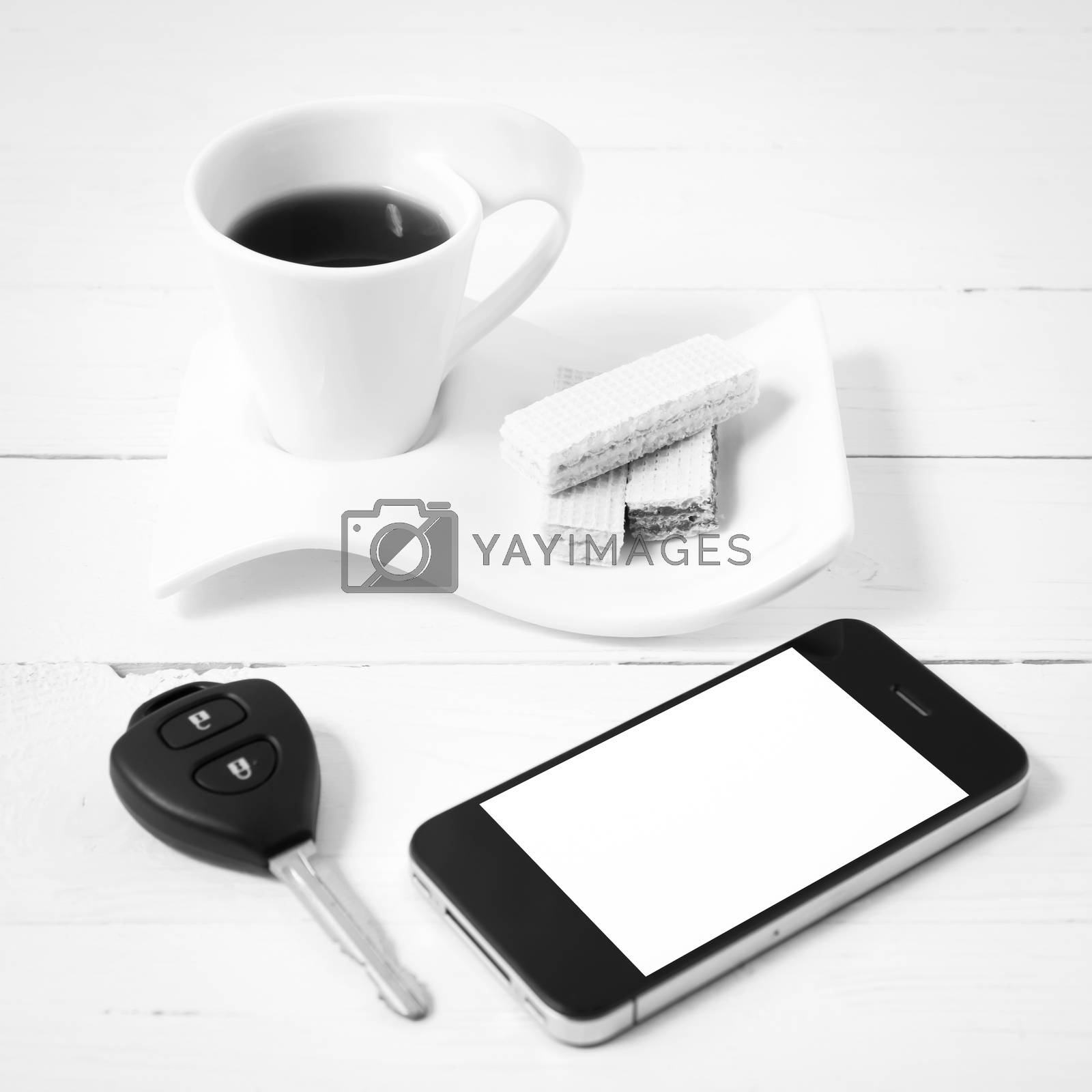 Royalty free image of coffee cup with wafer,phone,car key black and white color by ammza12