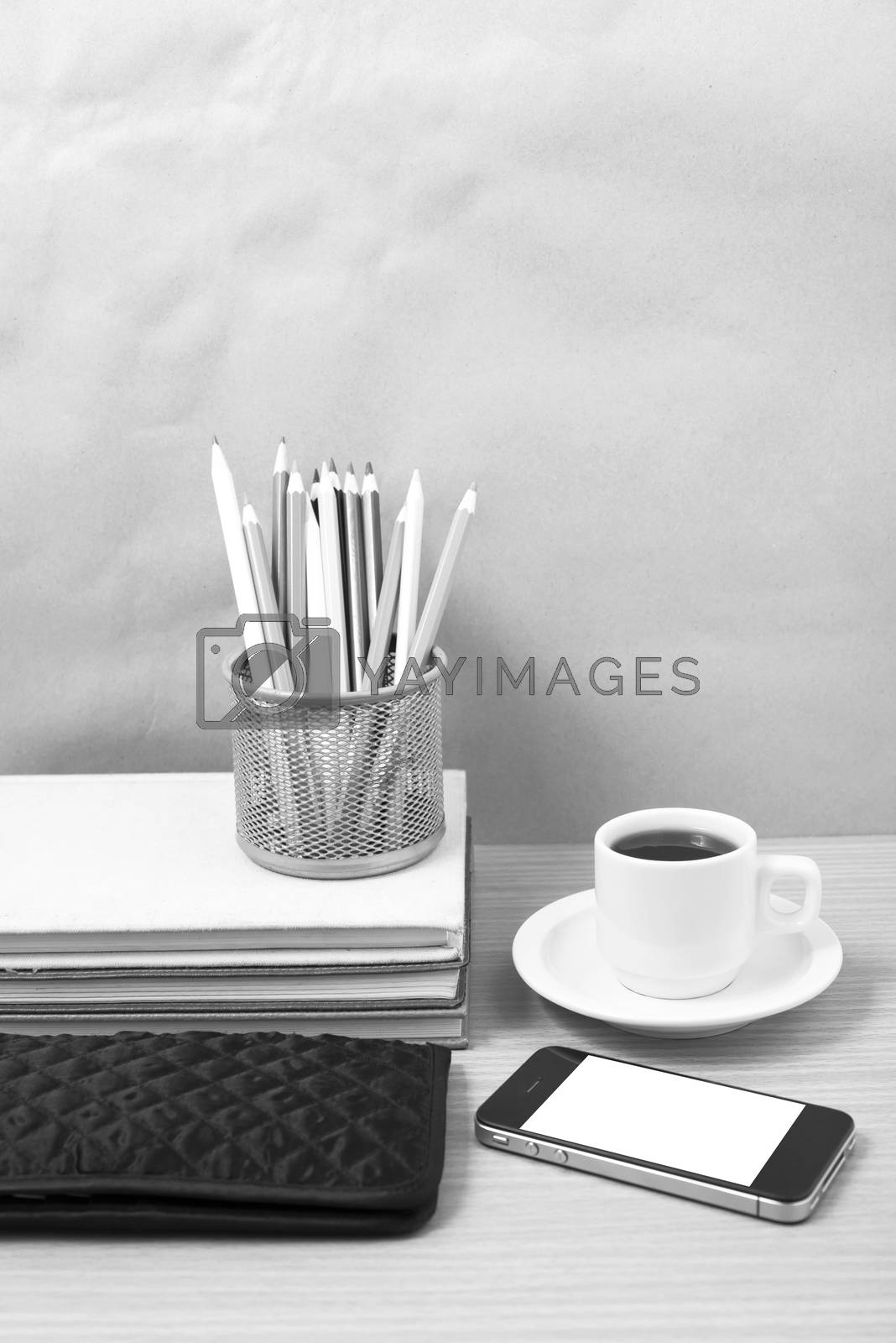 Royalty free image of office desk : coffee with phone,stack of book,wallet,color box b by ammza12