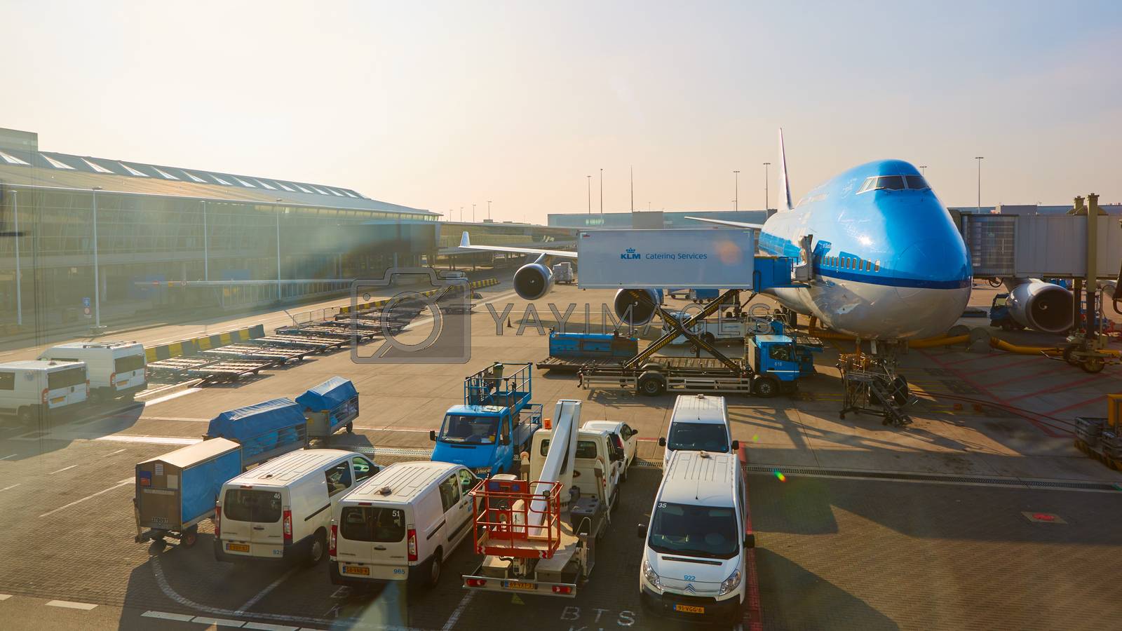 Royalty free image of KLM plane being loaded at Schiphol Airport. Amsterdam, Netherlands by sarymsakov
