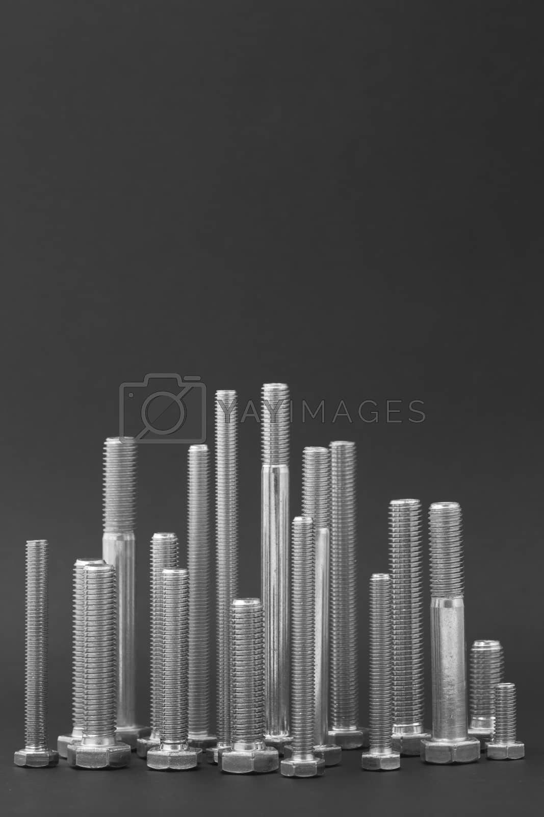 Royalty free image of Various Isolated bolts on a dark background by mailos