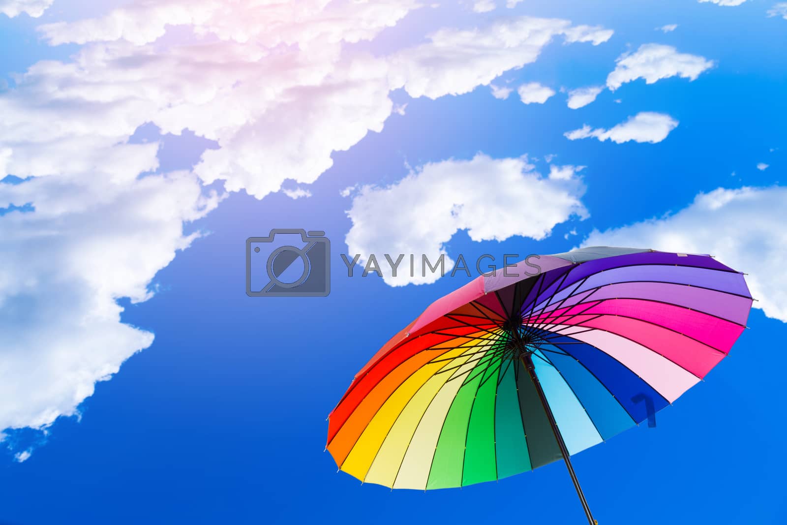 Royalty free image of Rainbow umbrella against the sky by boar26