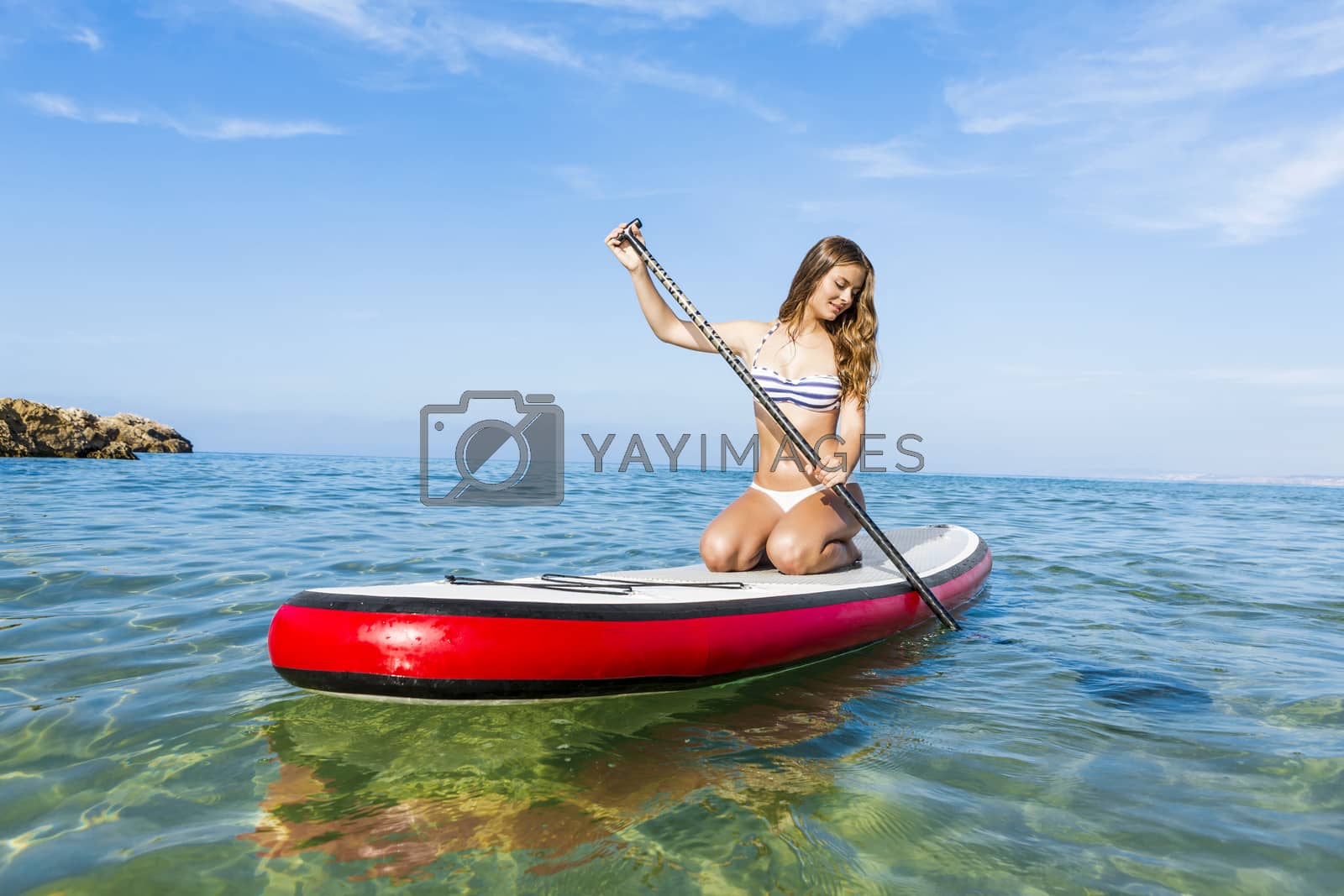 Royalty free image of Woman practicing paddle by Iko