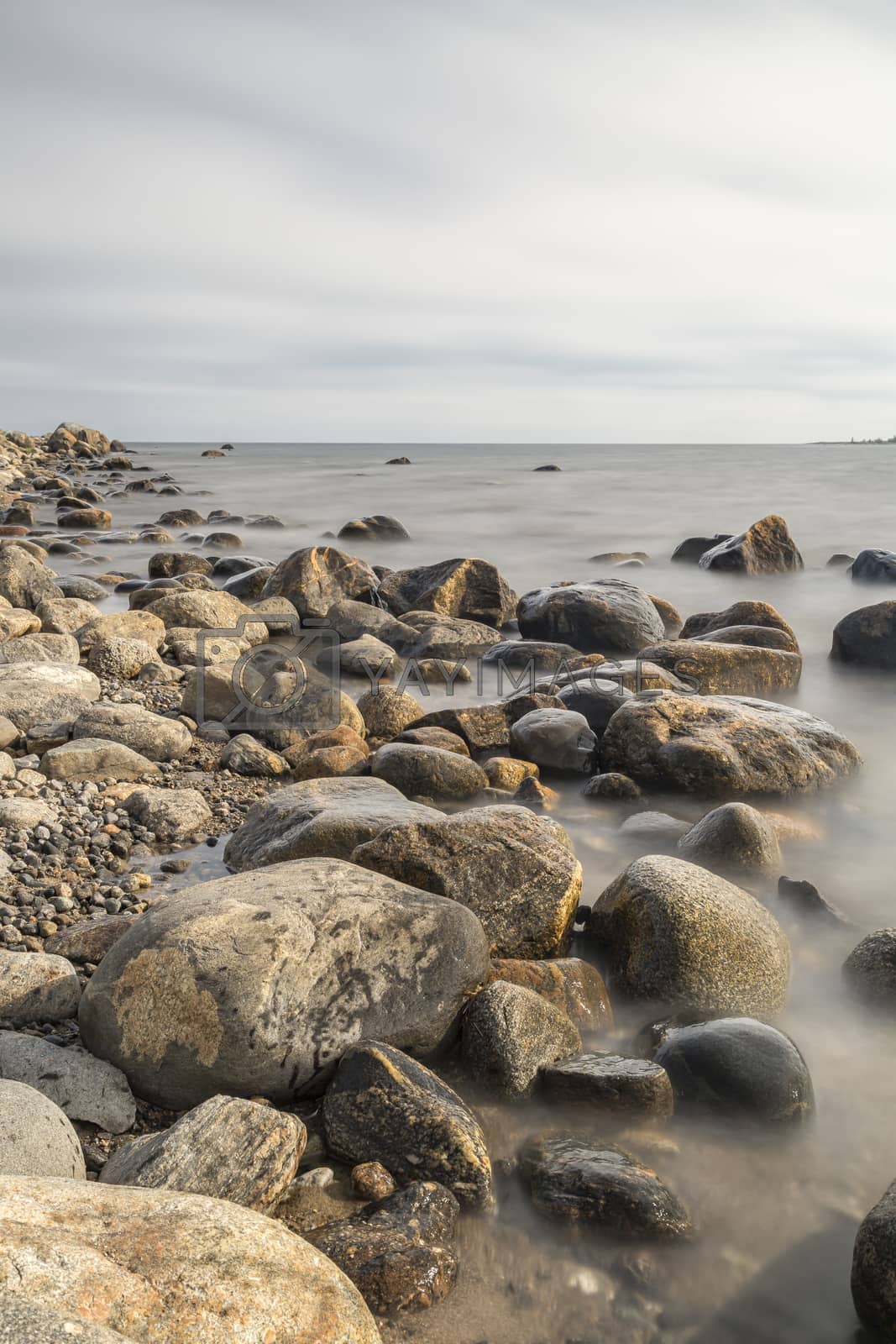 Royalty free image of Rocky Shoreline over Ocean by Emmoth
